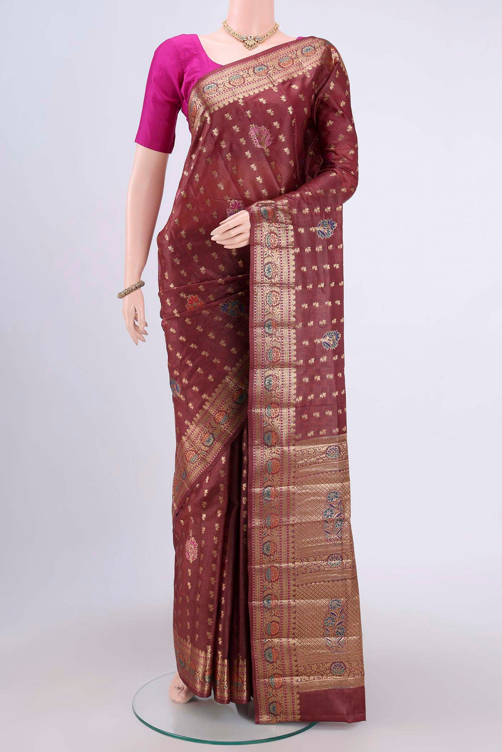 Brown Banarasi Tussar Silk Saree with Zari Butta on the body and Zari Border.  displayed on a mannequin
