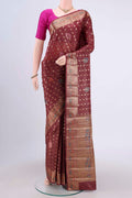 Brown Banarasi Tussar Silk Saree with Zari Butta on the body and Zari Border.  displayed on a mannequin