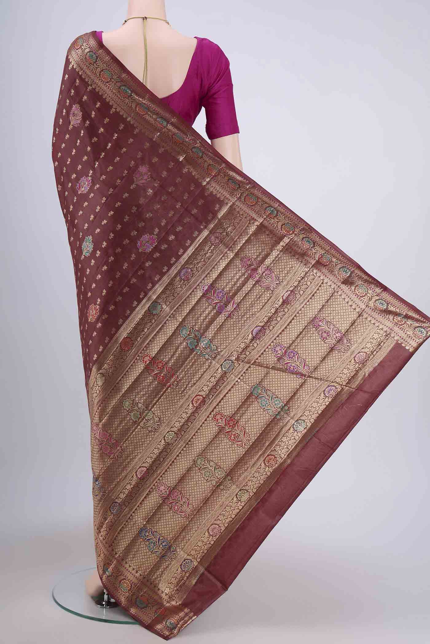 Flat view of Brown Banarasi Tussar Silk Saree with Zari Butta on the body and Zari Border. 