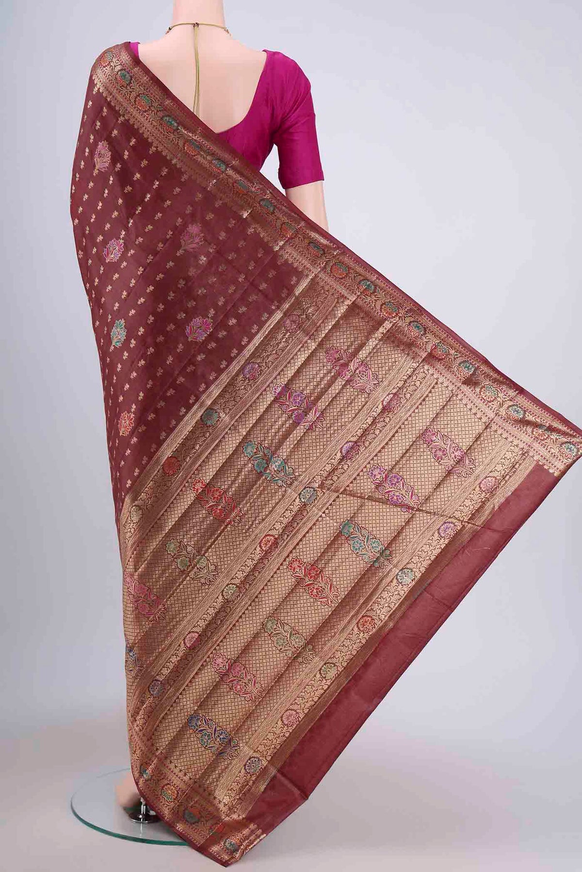 Flat view of Brown Banarasi Tussar Silk Saree with Zari Butta on the body and Zari Border. 