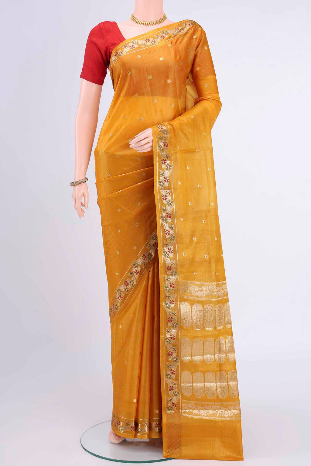 Mustard Banarasi Tussar Silk Saree with Zari Butta on the body and Zari Border displayed on a mannequin