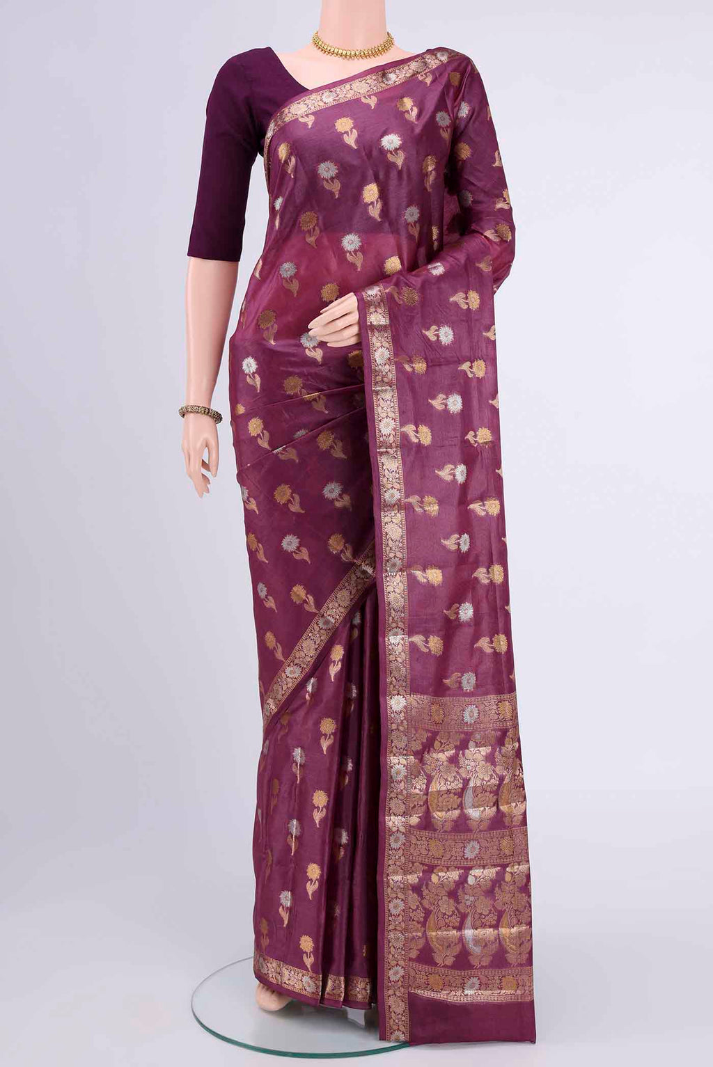 Dark Mauve Banarasi Tussar Silk Saree with Zari Butta on the body and Zari Border displayed on a mannequin