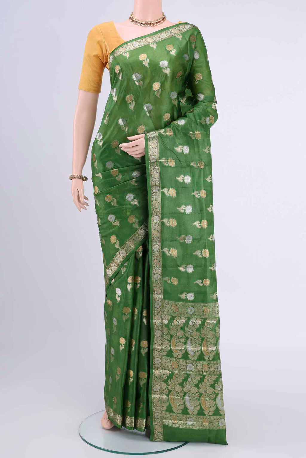 Green Banarasi Tussar Silk Saree with Zari Butta on the body and Zari Border displayed on a mannequin