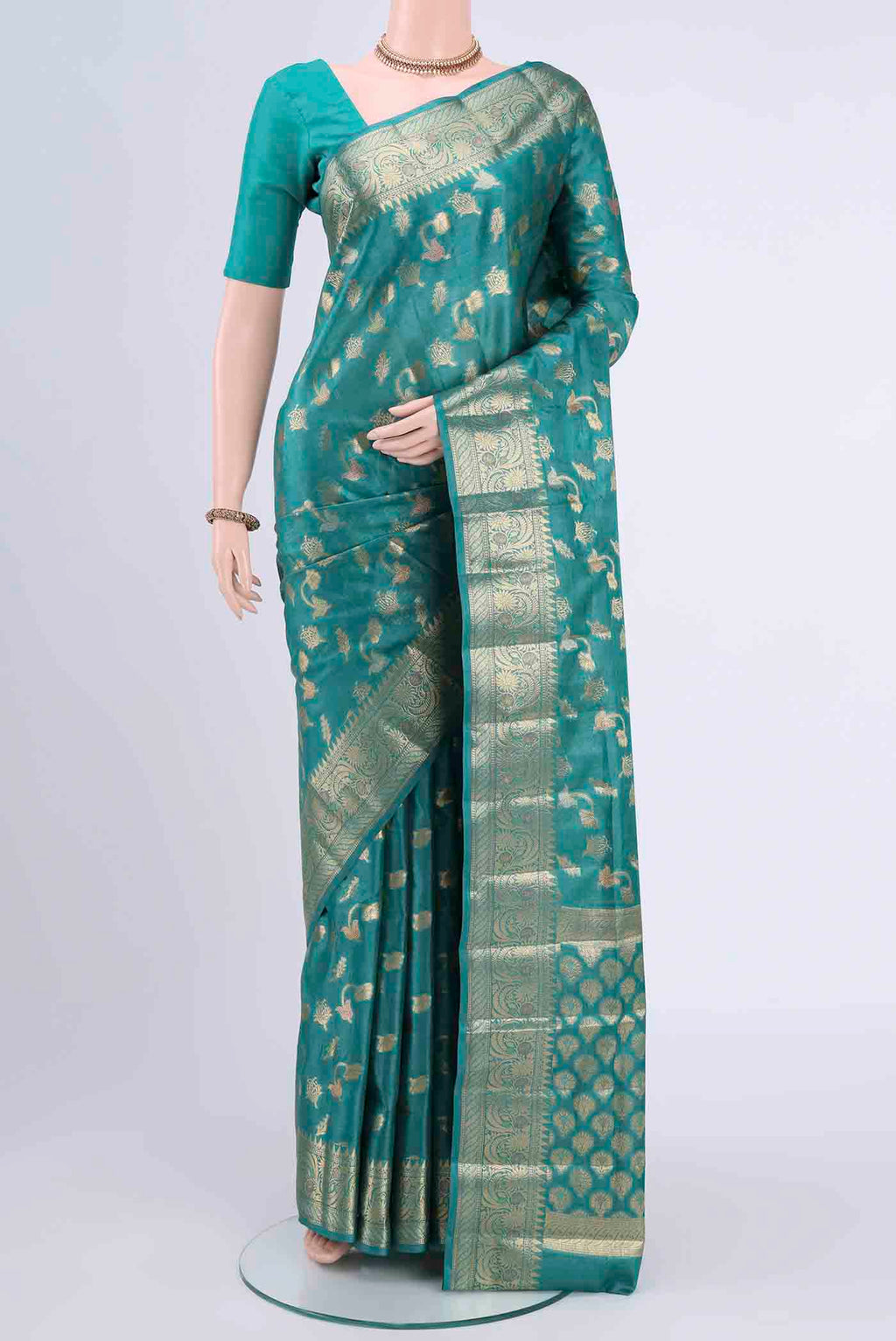 Blue Banarasi Tussar Silk Saree with Zari Butta on the body and Zari Border displayed on a mannequin