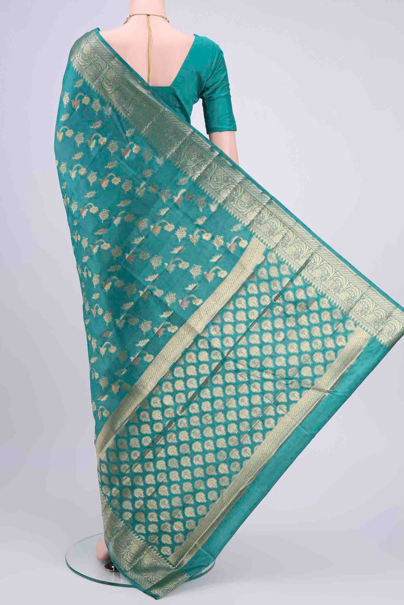 Flat view of Blue Banarasi Tussar Silk Saree with Zari Butta on the body and Zari Border