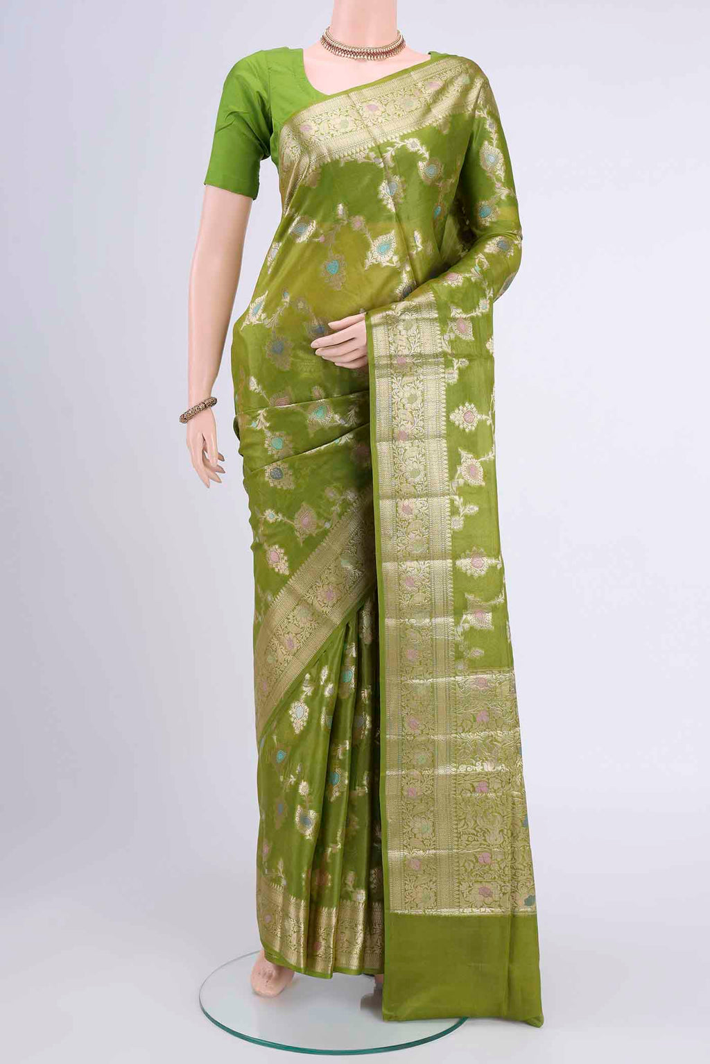 Light Green Banarasi Tussar Silk Saree with Zari Butta on the body and Zari Border displayed on a mannequin