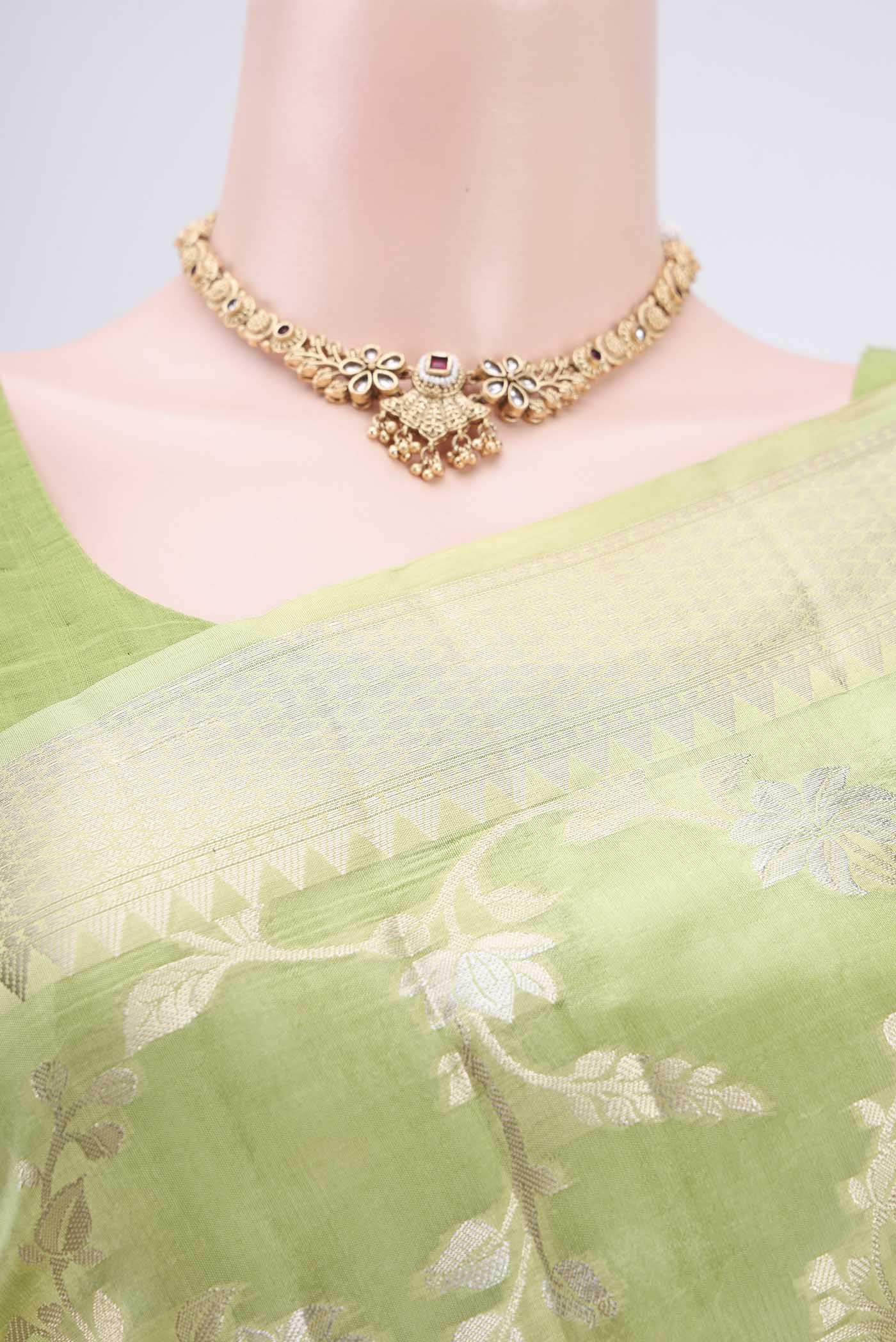Border image of Light Green Banarasi Raw Silk Saree with Zari Butta on the body and Zari Border. 