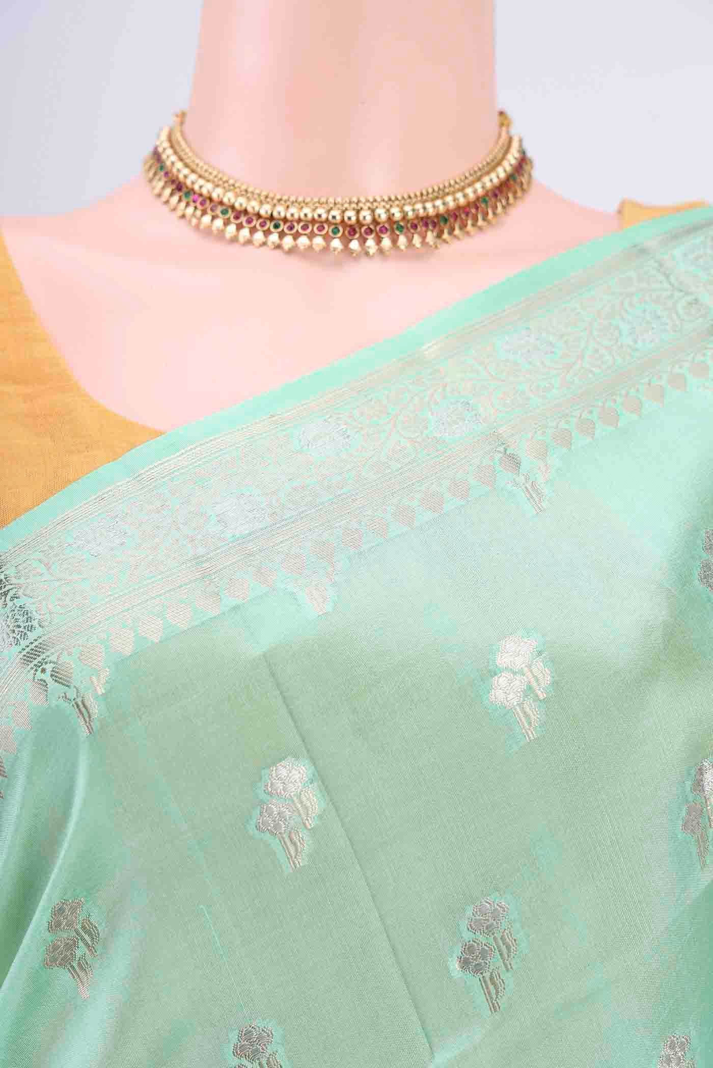 Border image of Mint Green Banarasi Raw Silk Saree with Zari Butta on the body and Zari Border