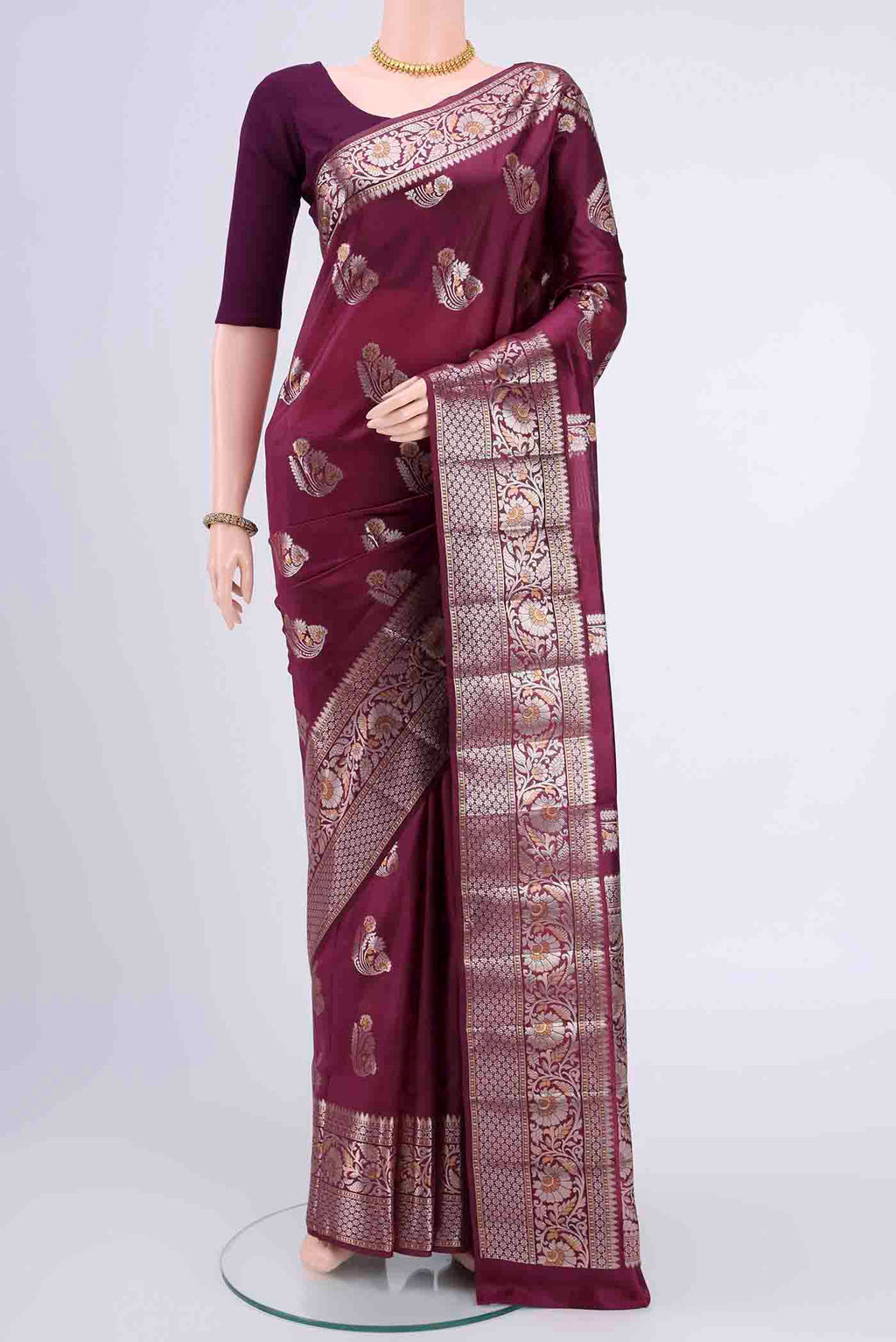 Dark Mauve Banarasi Raw Silk Saree with Zari Butta on the body and Zari Border displayed on a mannequin