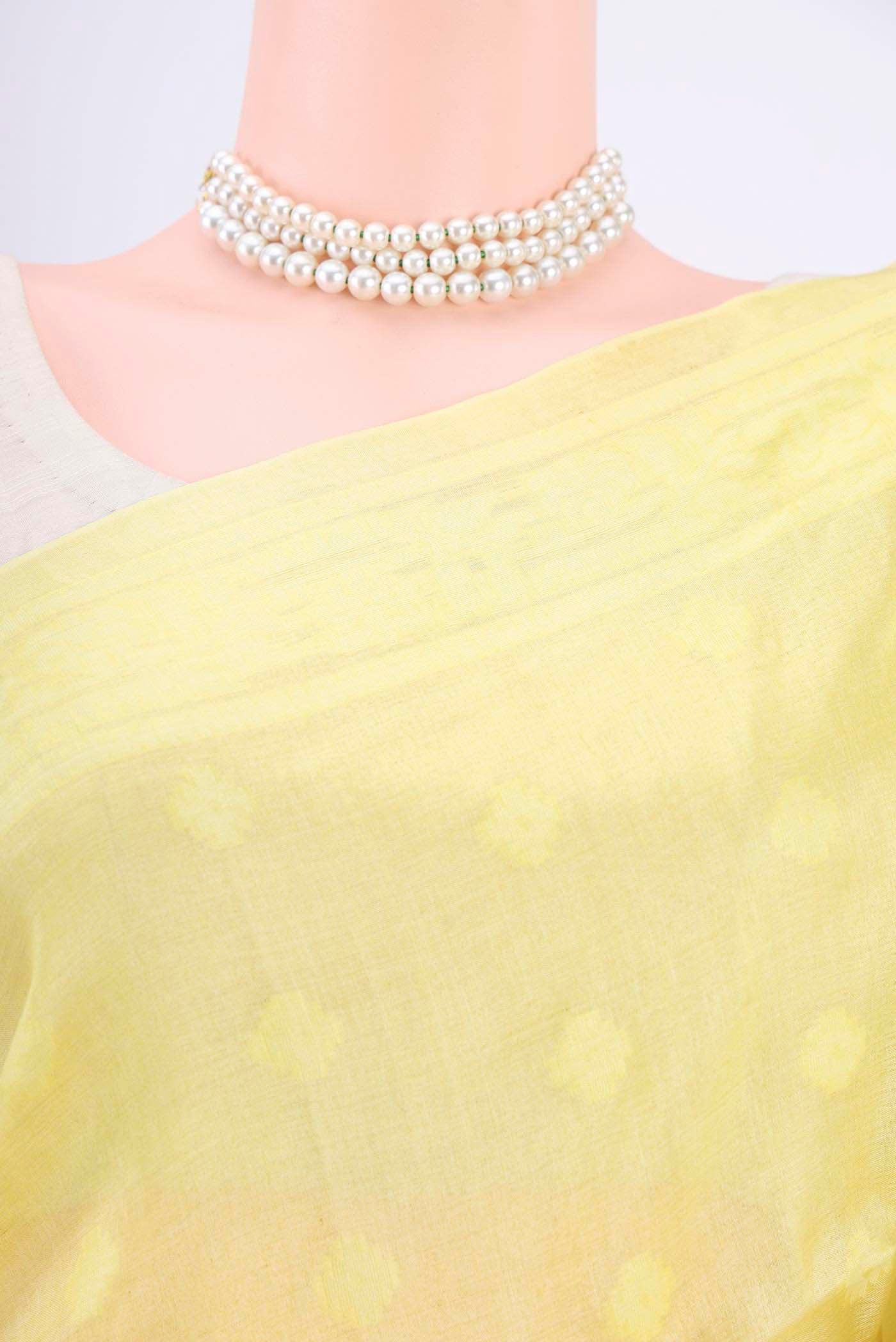 Border image of Lemon Yellow Tussar Silk Saree with Jamdani on the body and Plain Border