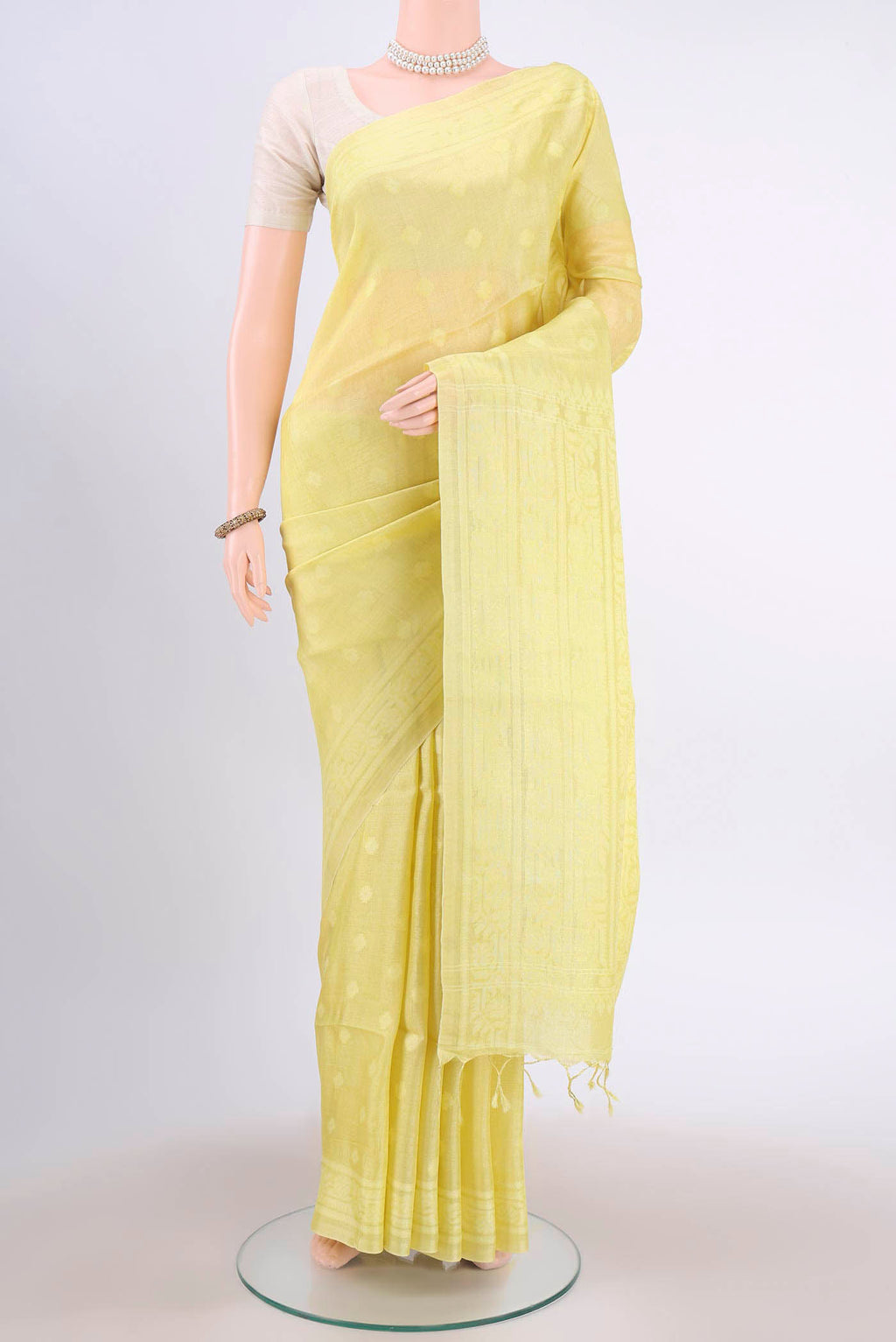 Lemon Yellow Tussar Silk Saree with Jamdani on the body and Plain Border displayed on a mannequin