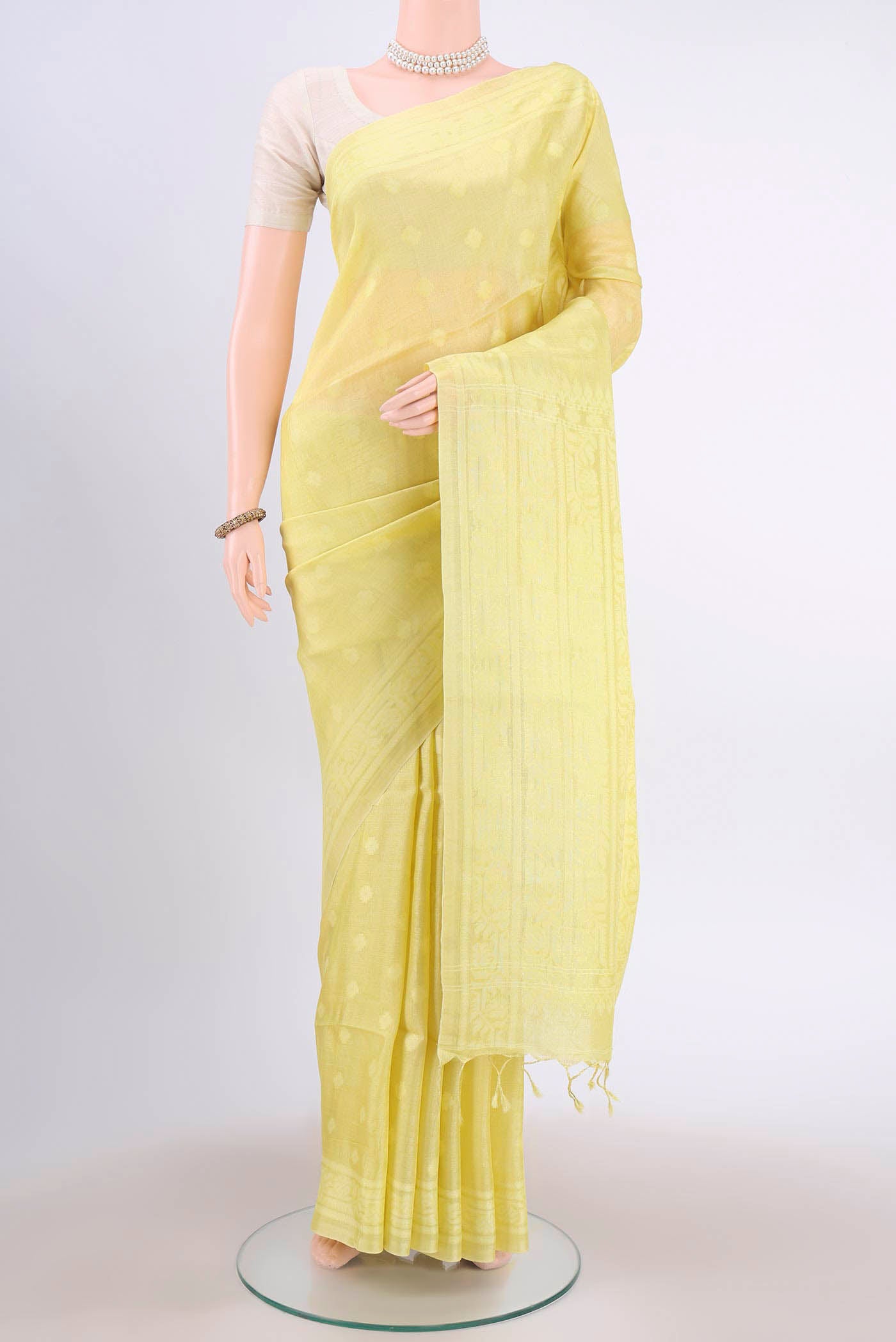 Lemon Yellow Tussar Silk Saree with Jamdani on the body and Plain Border displayed on a mannequin