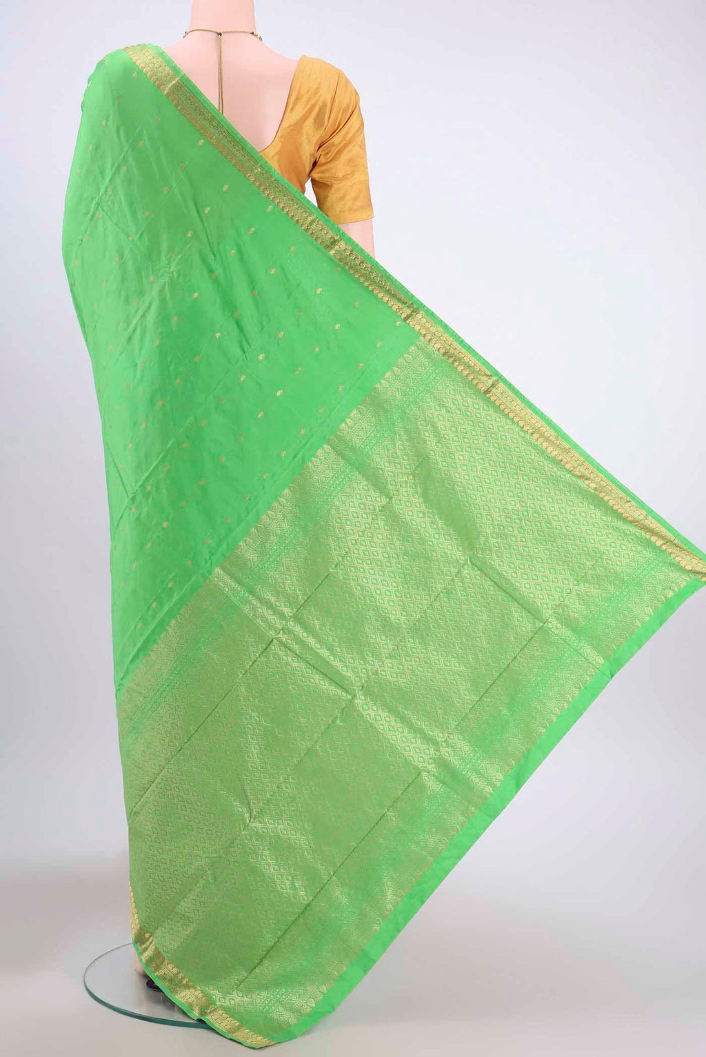 Flat view of Parrot Green Blended Bangalore Silk Saree with Zari Butta on the body and Zari Border
