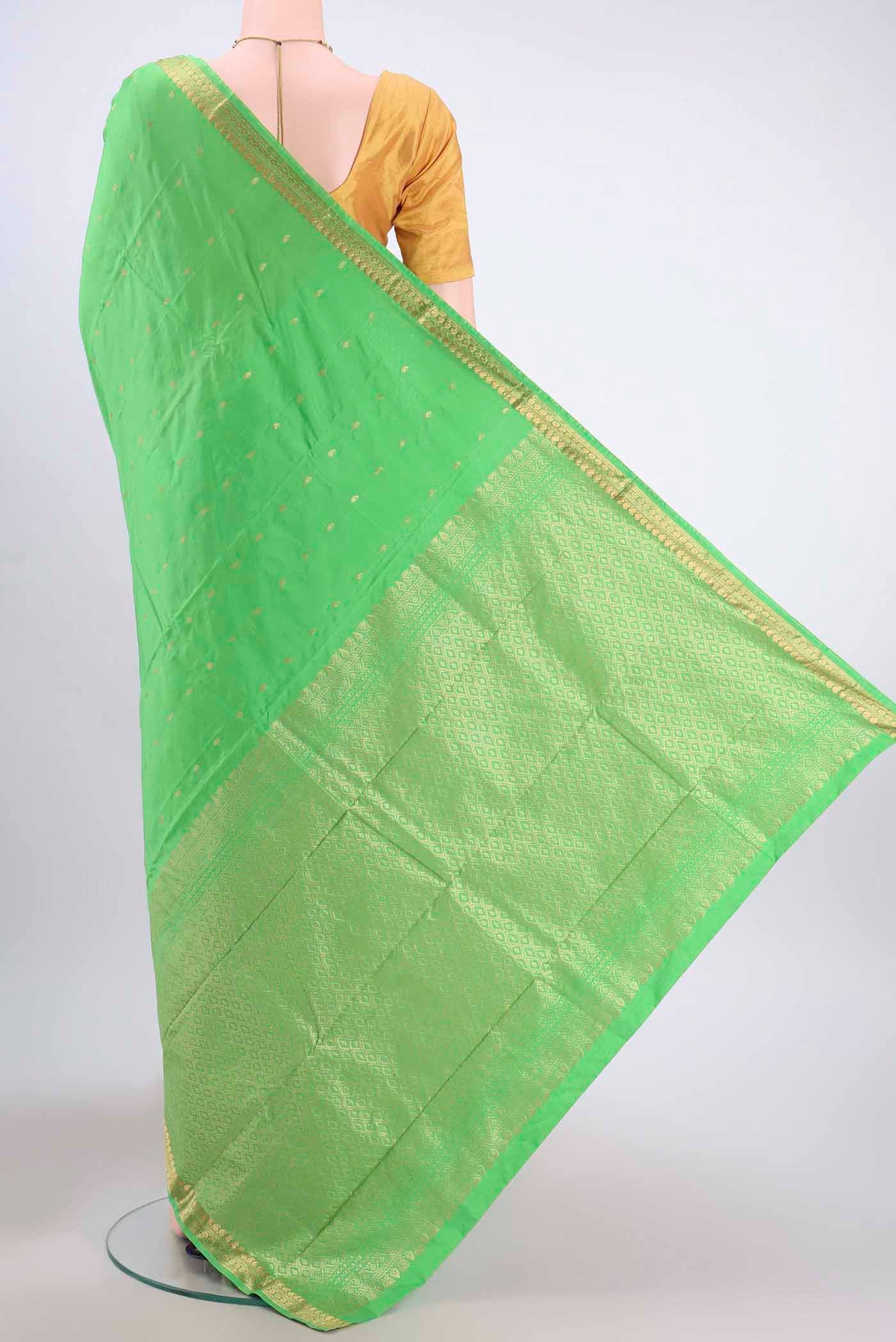 Flat view of Parrot Green Blended Bangalore Silk Saree with Zari Butta on the body and Zari Border