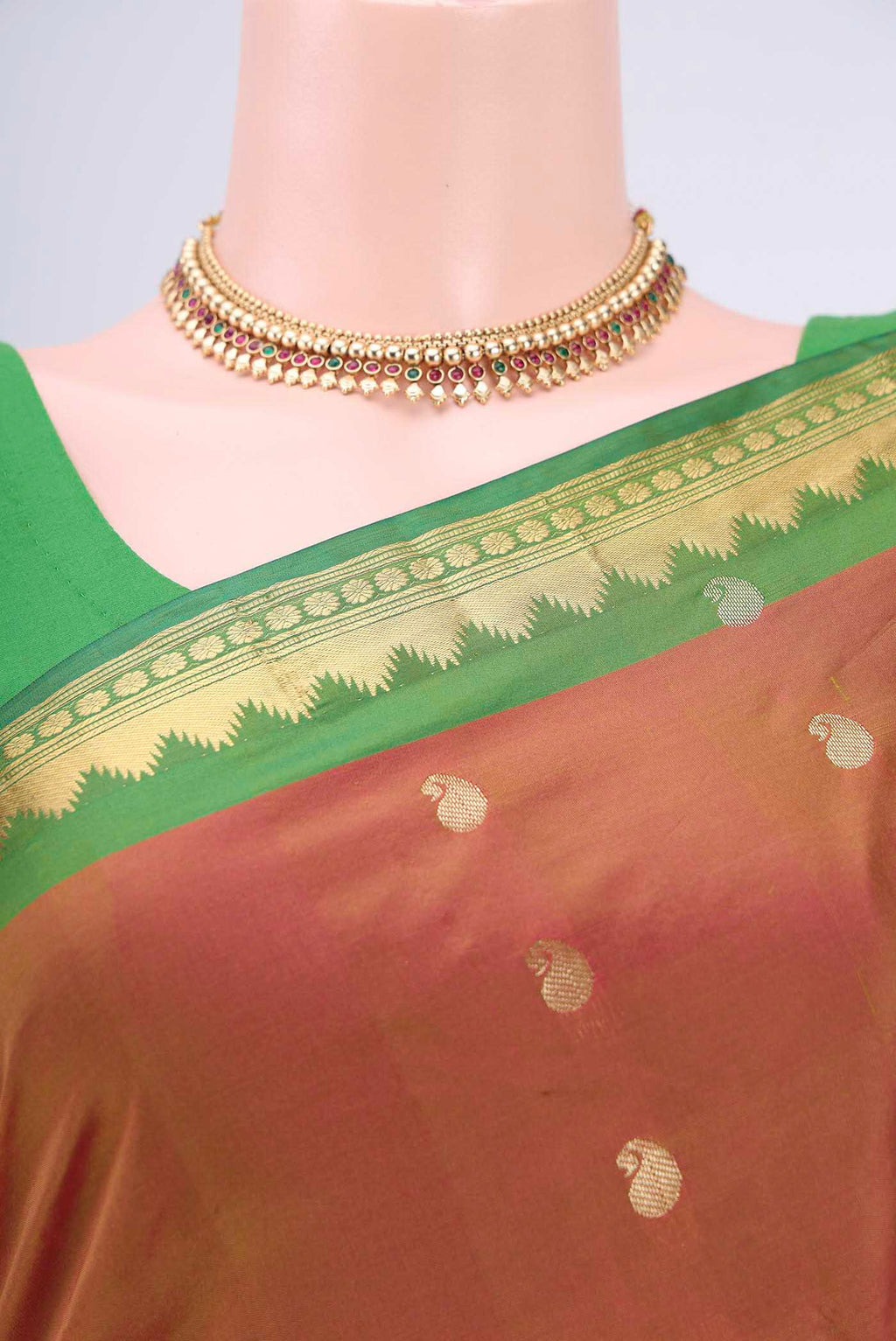 Border image of Brick Orange Dual Tone Blended Bangalore Silk Saree with Zari Butta on the body and Temple Border. 