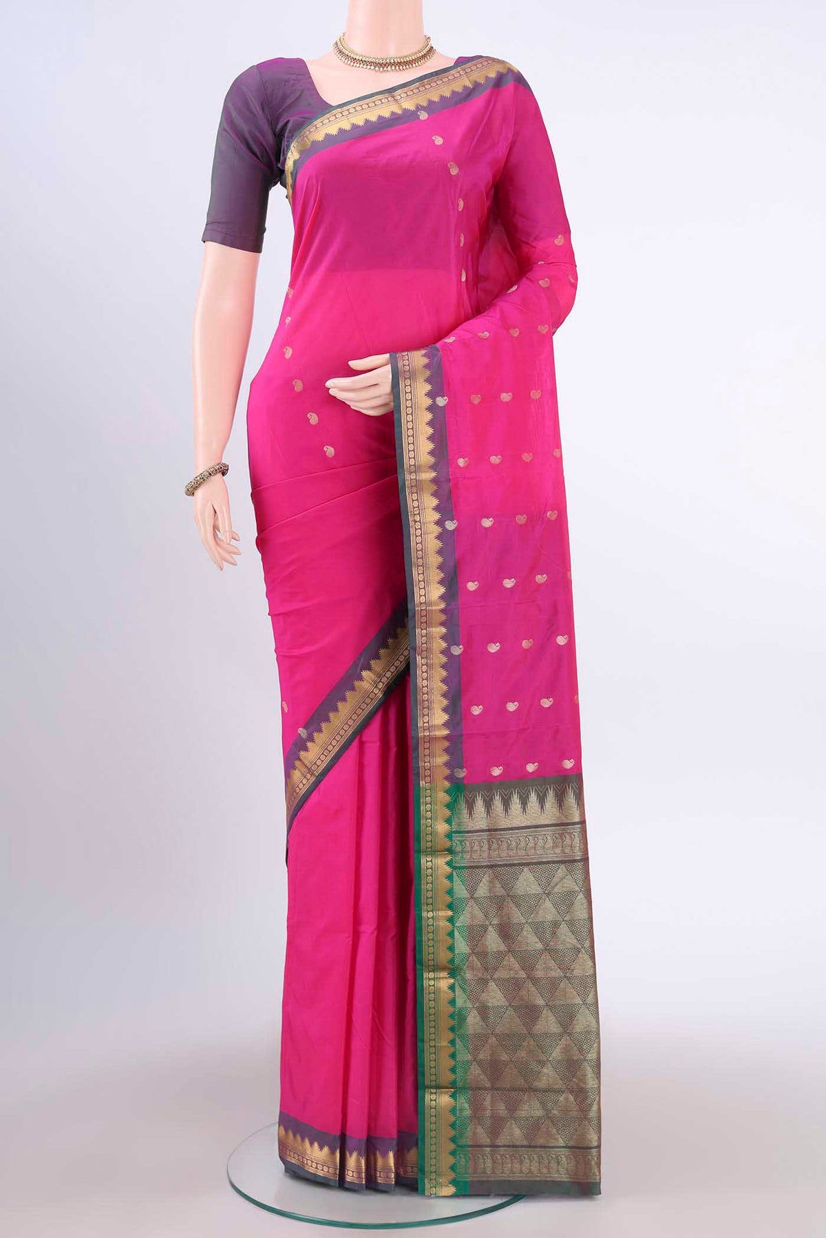 Rani Pink Blended Bangalore Silk Saree with Zari Butta on the body and Temple Border displayed on a mannequin