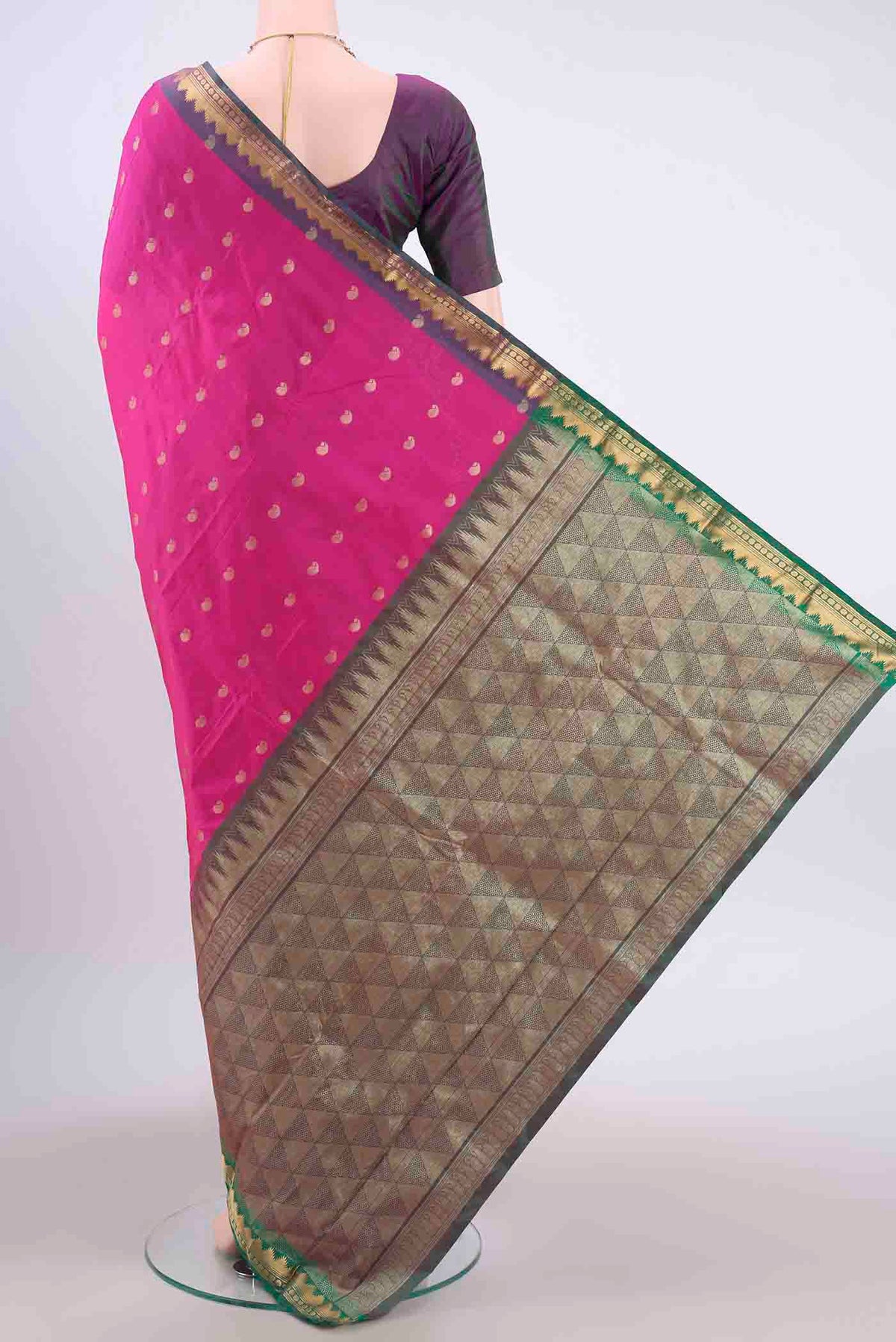Flat view of Rani Pink Blended Bangalore Silk Saree with Zari Butta on the body and Temple Border