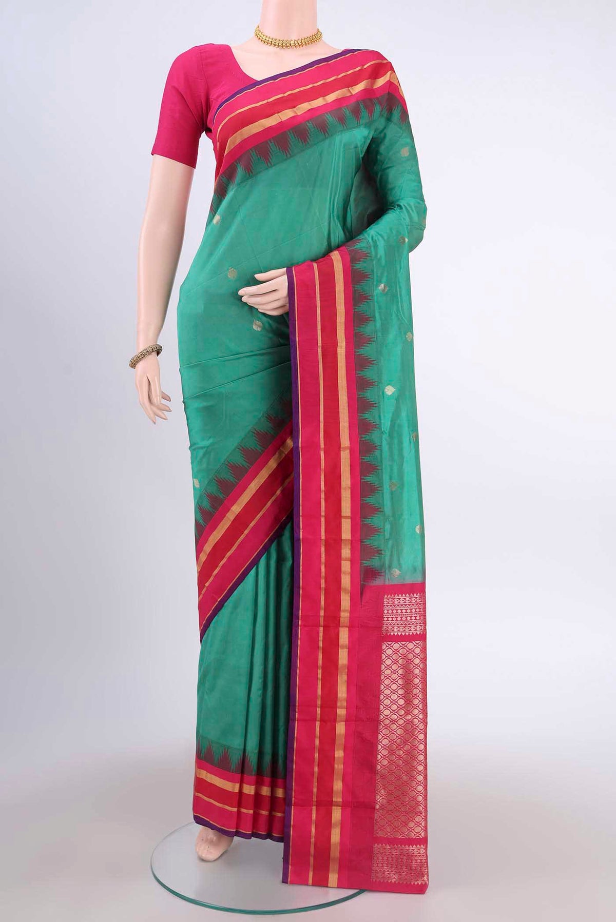 Sea Green Blended Bangalore Silk Saree with Zari Butta on the body and Temple Border displayed on a mannequin
