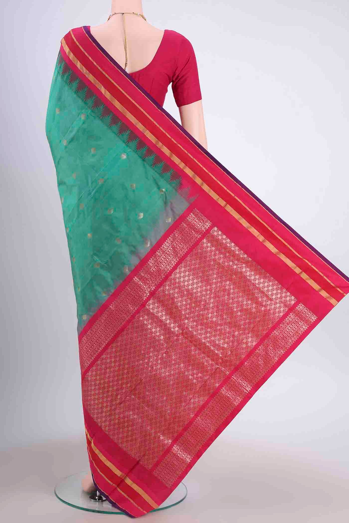 Flat view of Sea Green Blended Bangalore Silk Saree with Zari Butta on the body and Temple Border