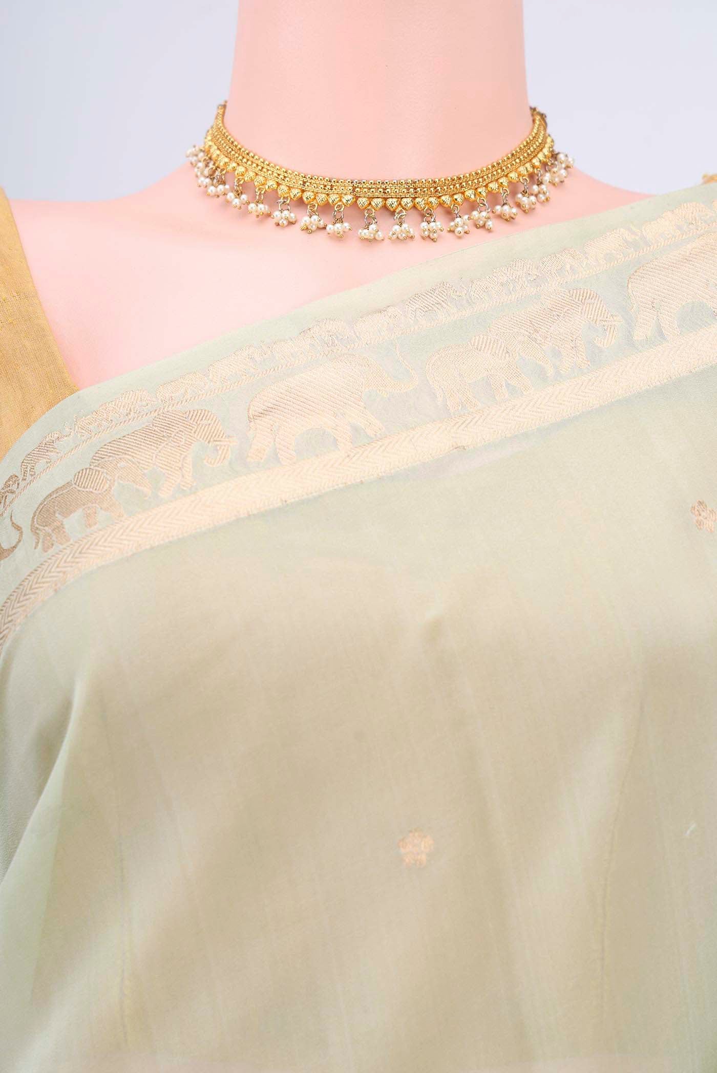 Border image of Mint Green Organza Silk Saree with Zari Butta on the body and Zari Border