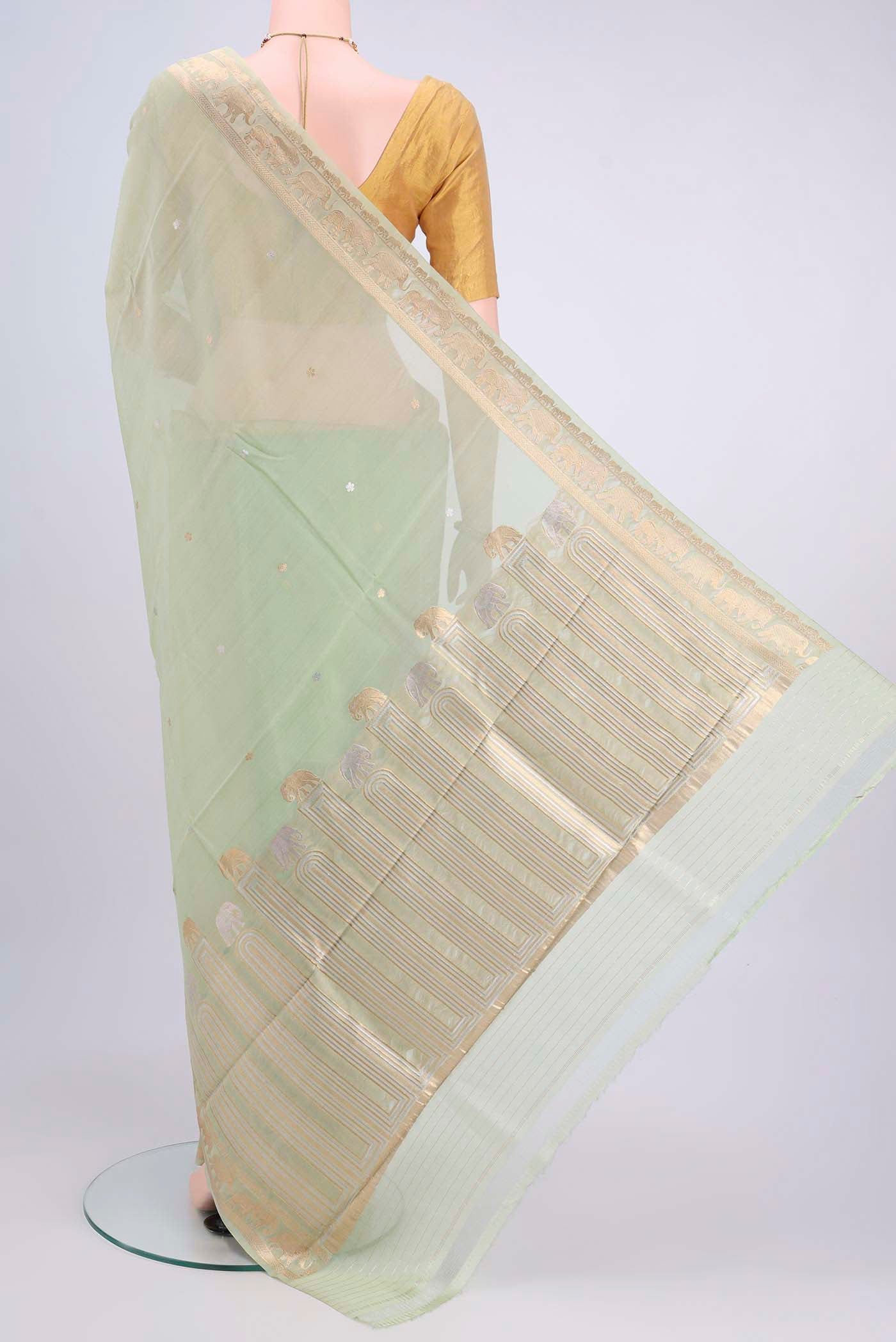 Flat view of Mint Green Organza Silk Saree with Zari Butta on the body and Zari Border