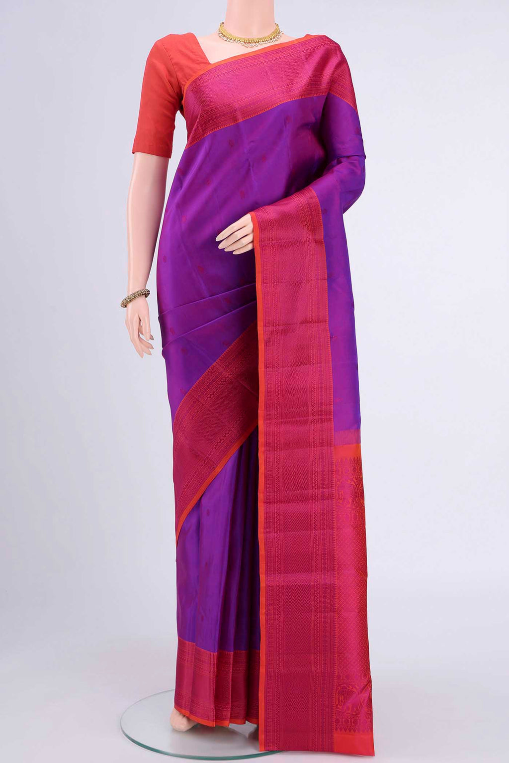 Magenta Kanchipuram Silk Saree with Thread Butta on the body and Thread Border displayed on a mannequin