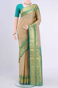 Beige Kanchipuram Saree with Checked design on the body and Zari Border displayed on a mannequin