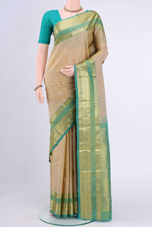 Beige Kanchipuram Saree with Checked design on the body and Zari Border displayed on a mannequin