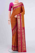 Mustard Kanchipuram Saree with Checked design on the body and Zari Border displayed on a mannequin