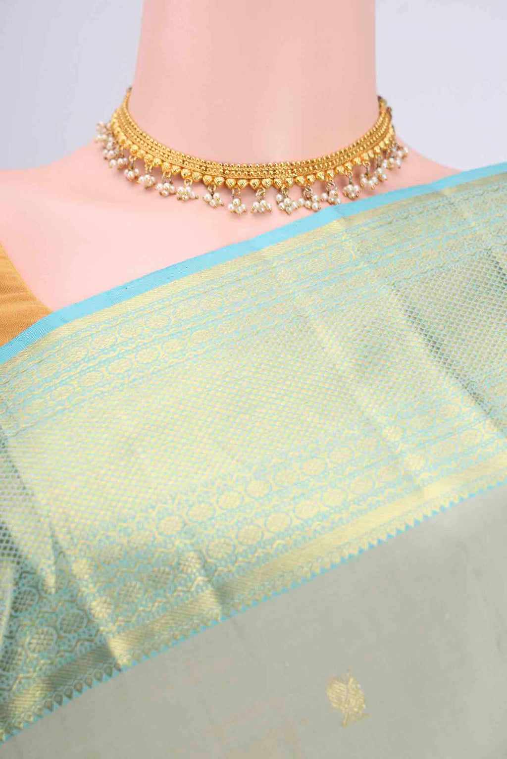 Border image of Sage Green Kanchipuram Saree with Zari Butta on the body and Zari Border