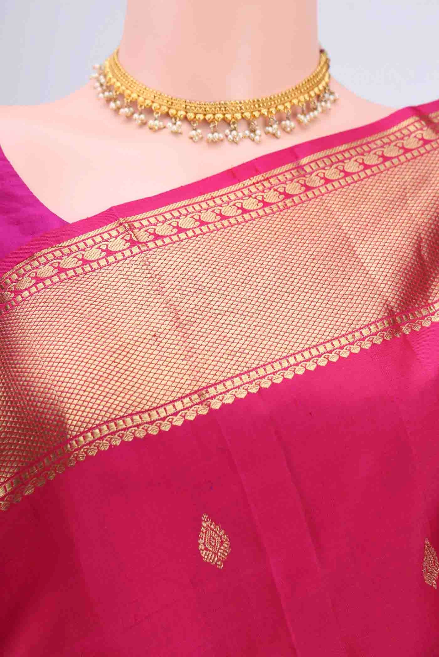 Border image of Dark Pink Kanchipuram Saree with Zari Butta on the body and Zari Border