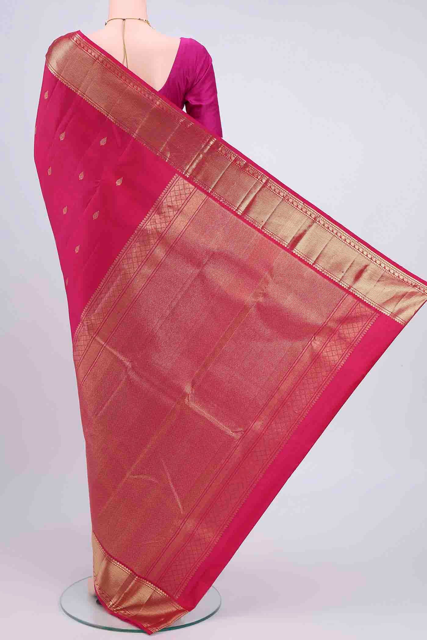 Flat view of Dark Pink Kanchipuram Saree with Zari Butta on the body and Zari Border