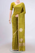 Parrot Green Banarasi Katan Silk Saree with Zari Butta on the body and Zari Border.  displayed on a mannequin
