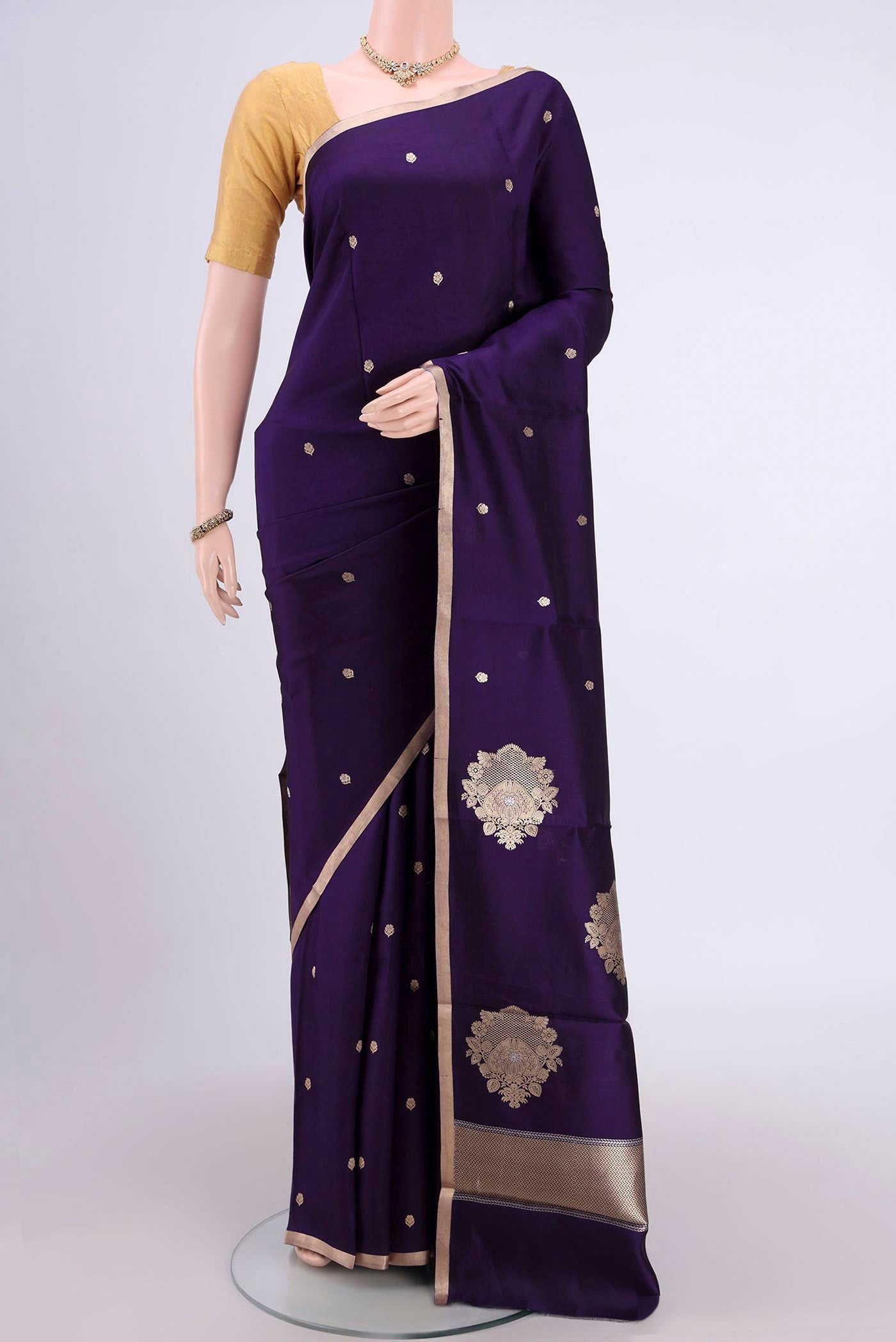 Purple Banarasi Katan Silk Saree with Zari Butta on the body and Zari Border.  displayed on a mannequin
