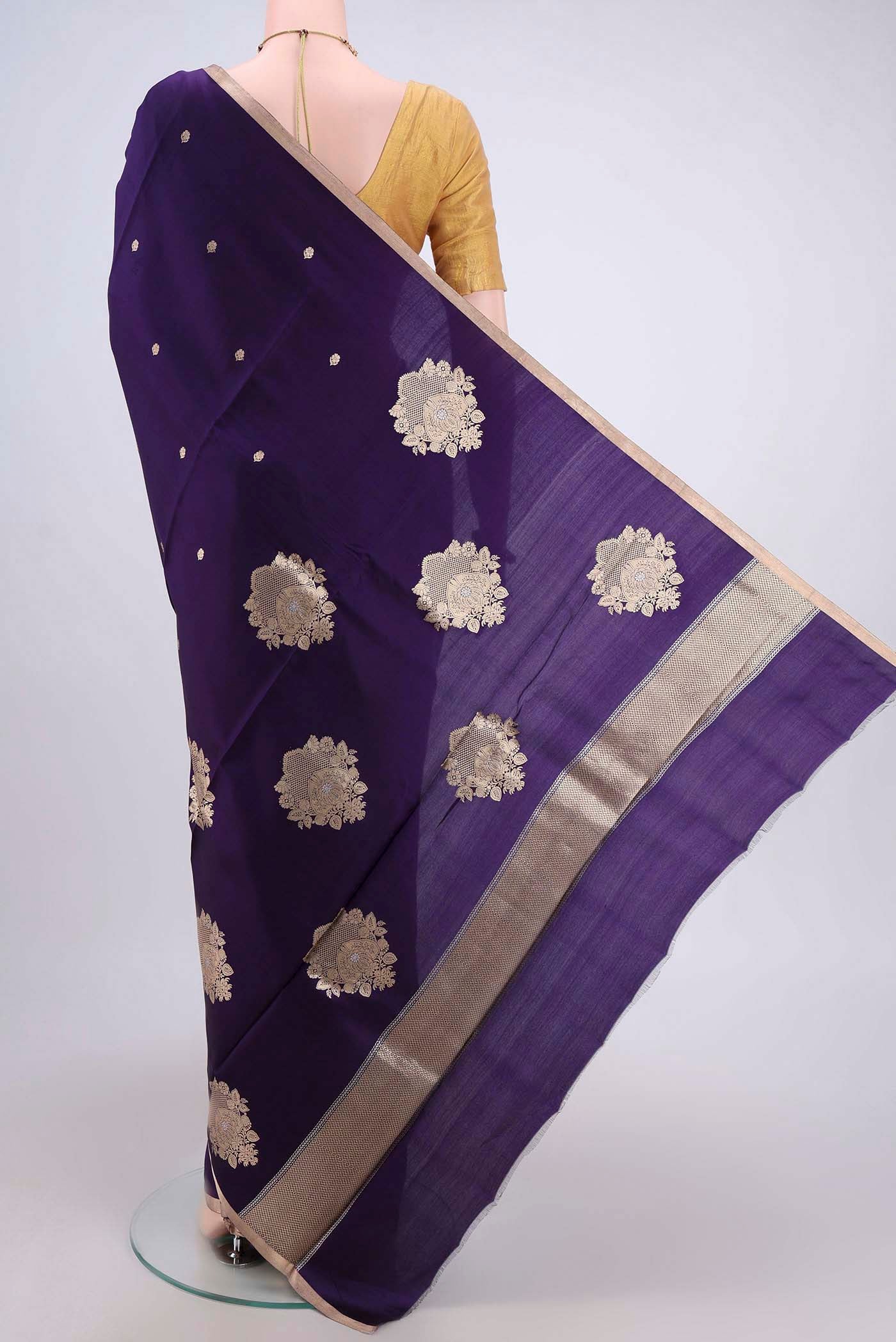 Flat view of Purple Banarasi Katan Silk Saree with Zari Butta on the body and Zari Border. 