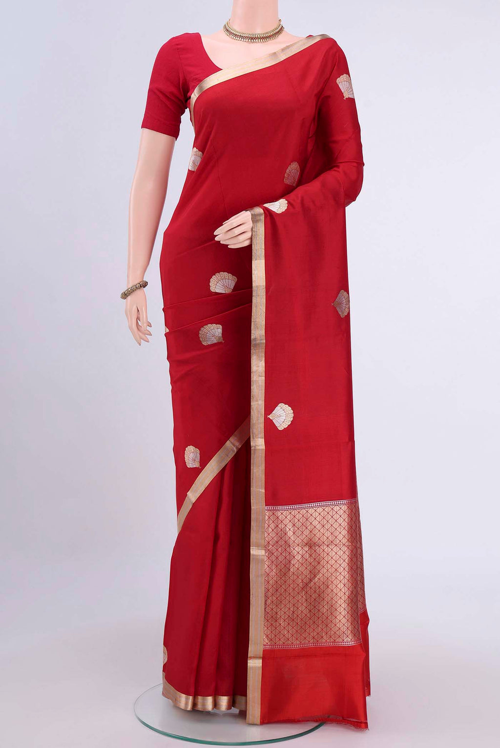 Red Banarasi Silk Saree with Zari Butta on the body and Zari Border displayed on a mannequin