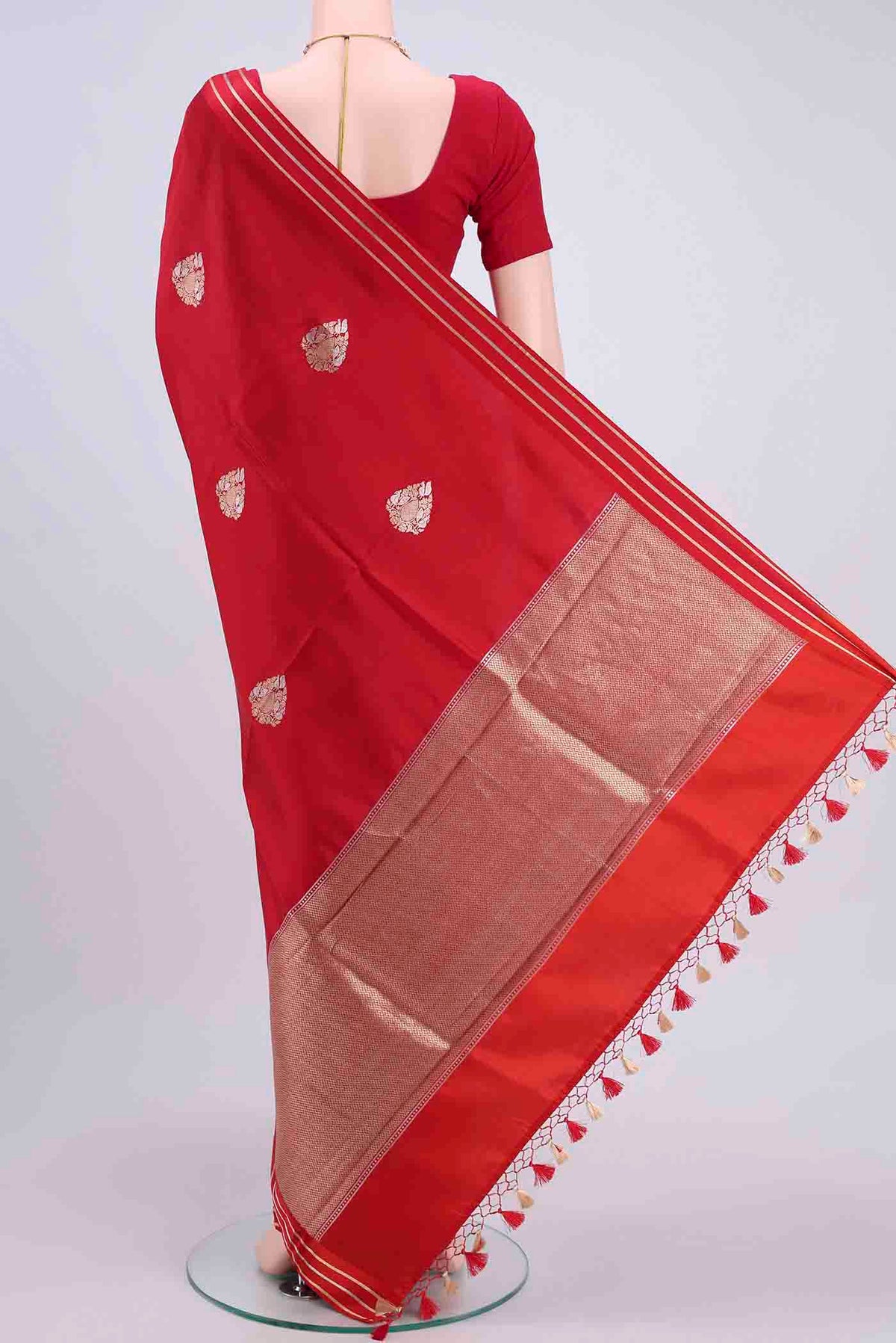 Flat view of Red Banarasi Silk Saree with Zari Butta on the body and Satin Border