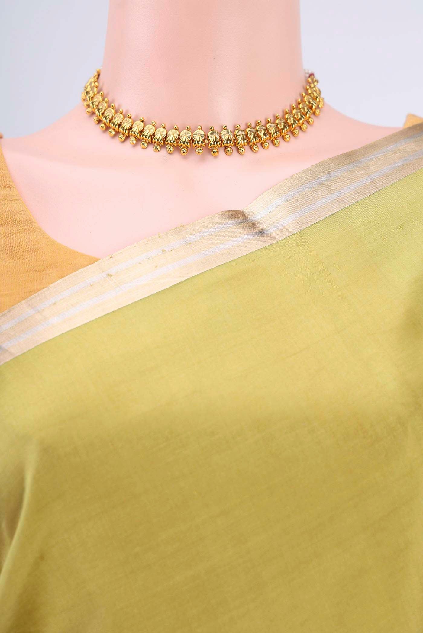 Border image of Light Green Banarasi Katan Silk Saree with Zari Butta on the body and Thin Zari Line
