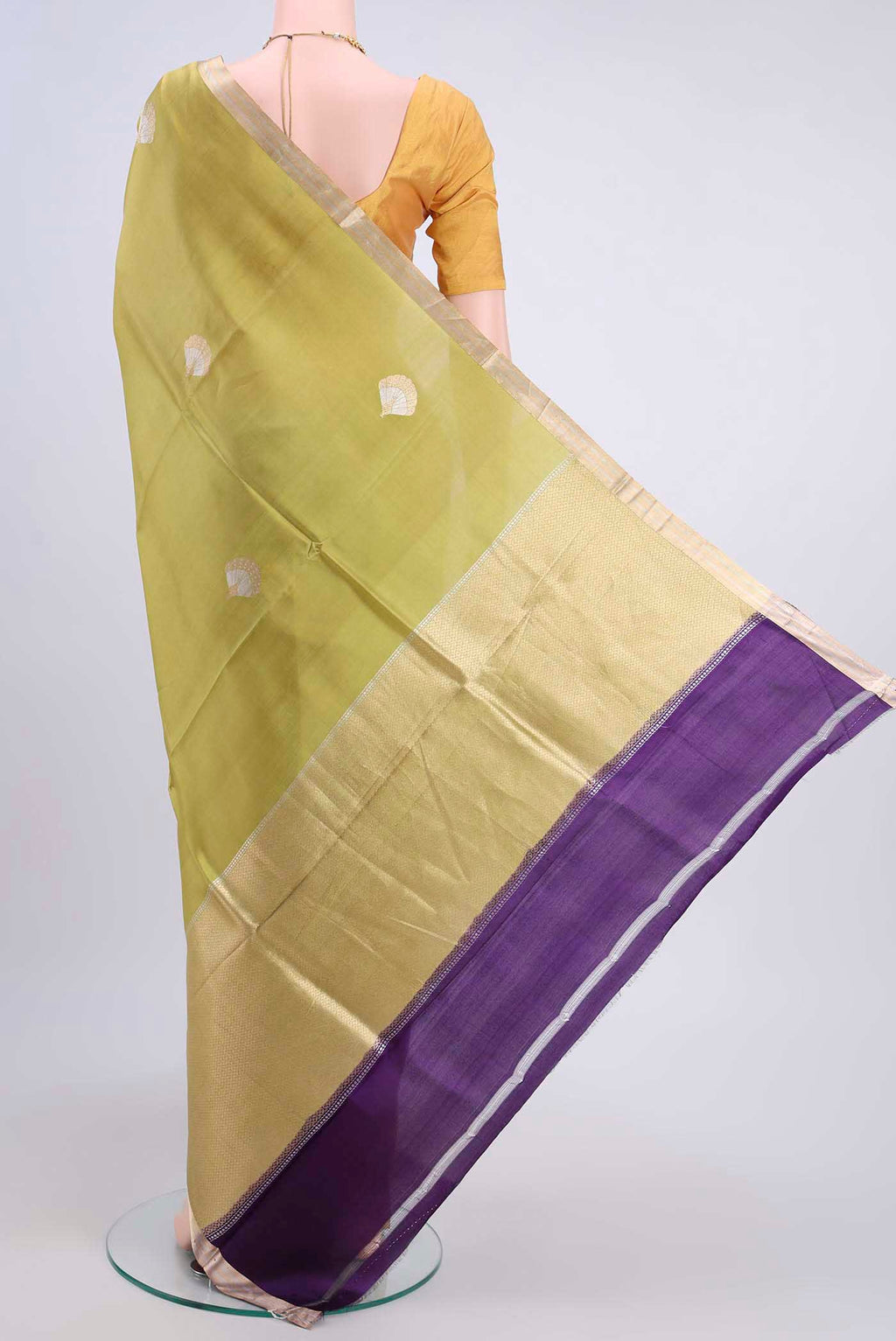 Flat view of Light Green Banarasi Katan Silk Saree with Zari Butta on the body and Thin Zari Line