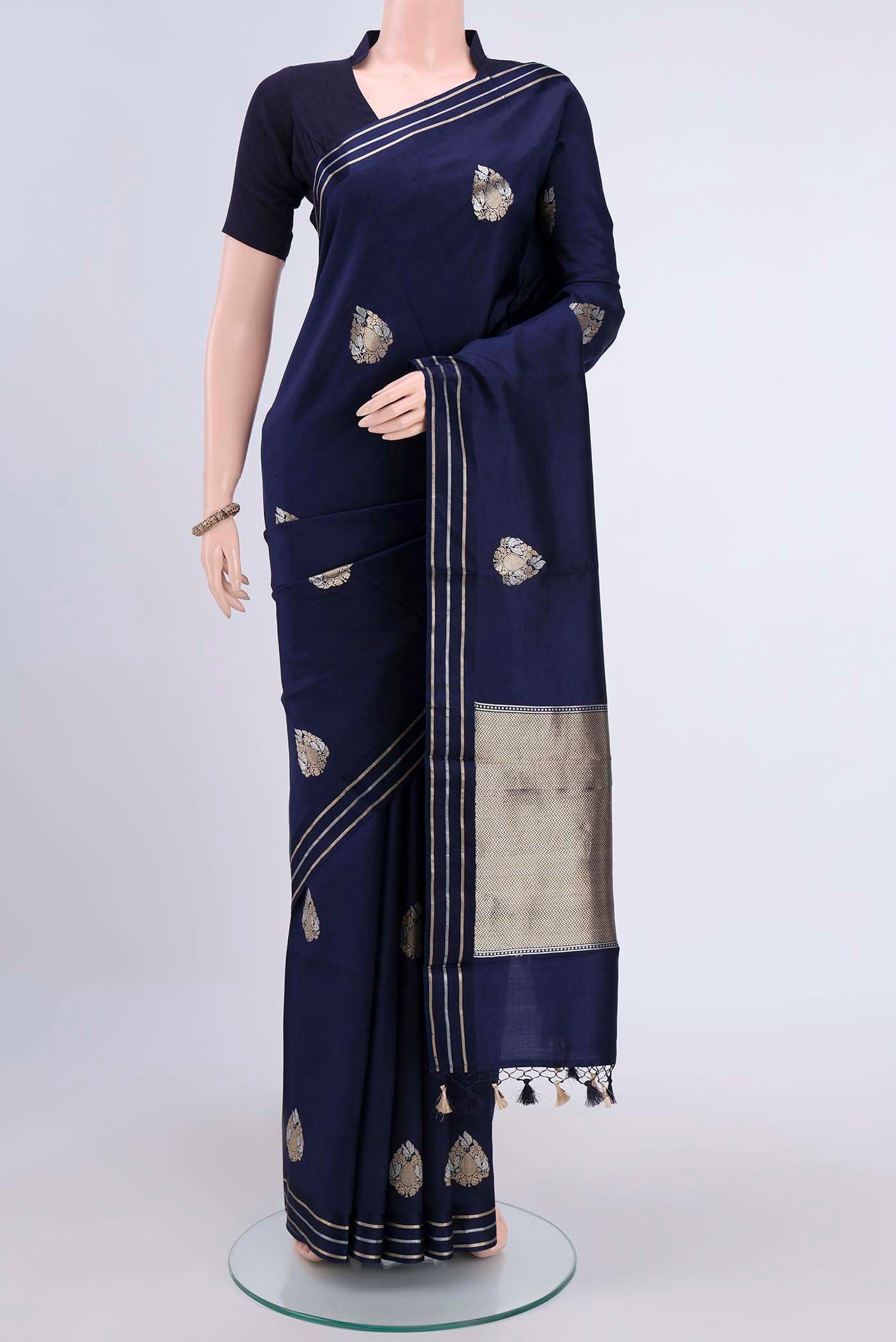 Navy Blue Banarasi Silk Saree with Zari Butta on the body and Satin Border displayed on a mannequin