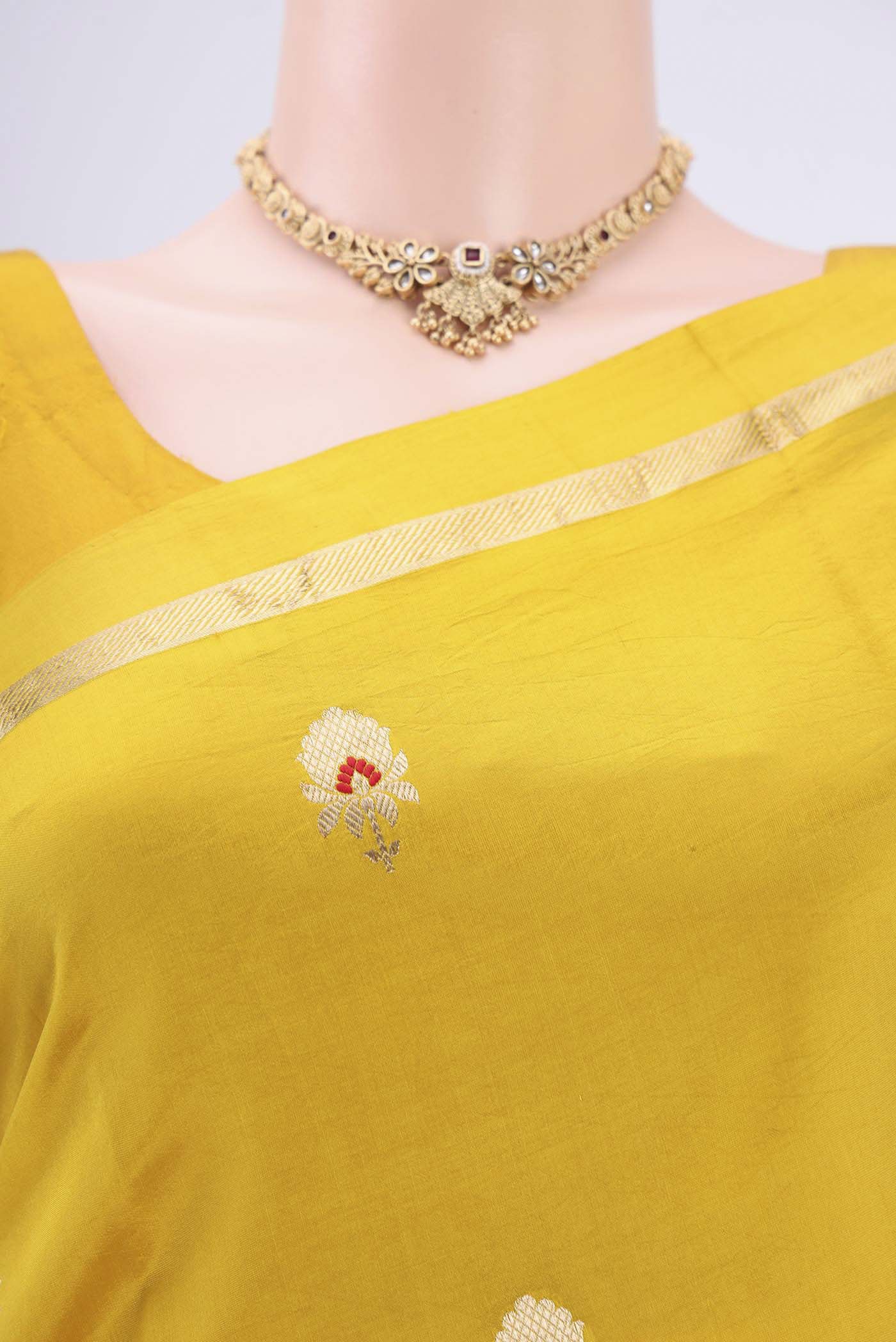 Border image of Yellow Banarasi Saree with Zari Butta on the body and Zari Border. 