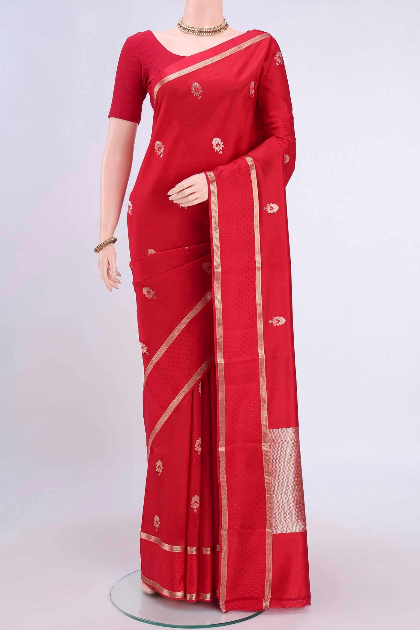 Red Banarasi Silk Saree with Zari Butta on the body and Zari Border displayed on a mannequin