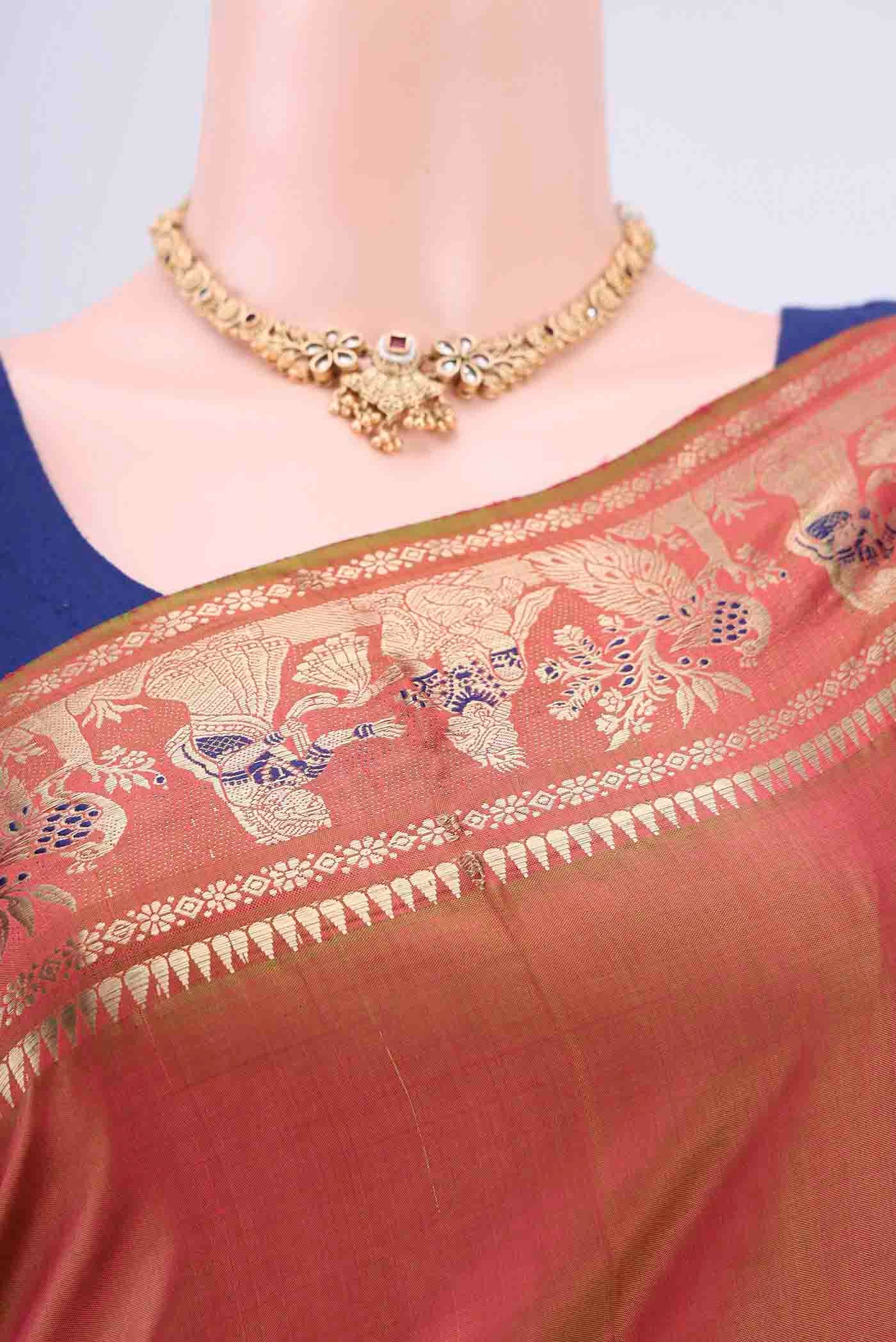 Border image of Rust Dual Tone Baluchari Silk Saree with Zari And Thread Butta on the body and Zari Border. 
