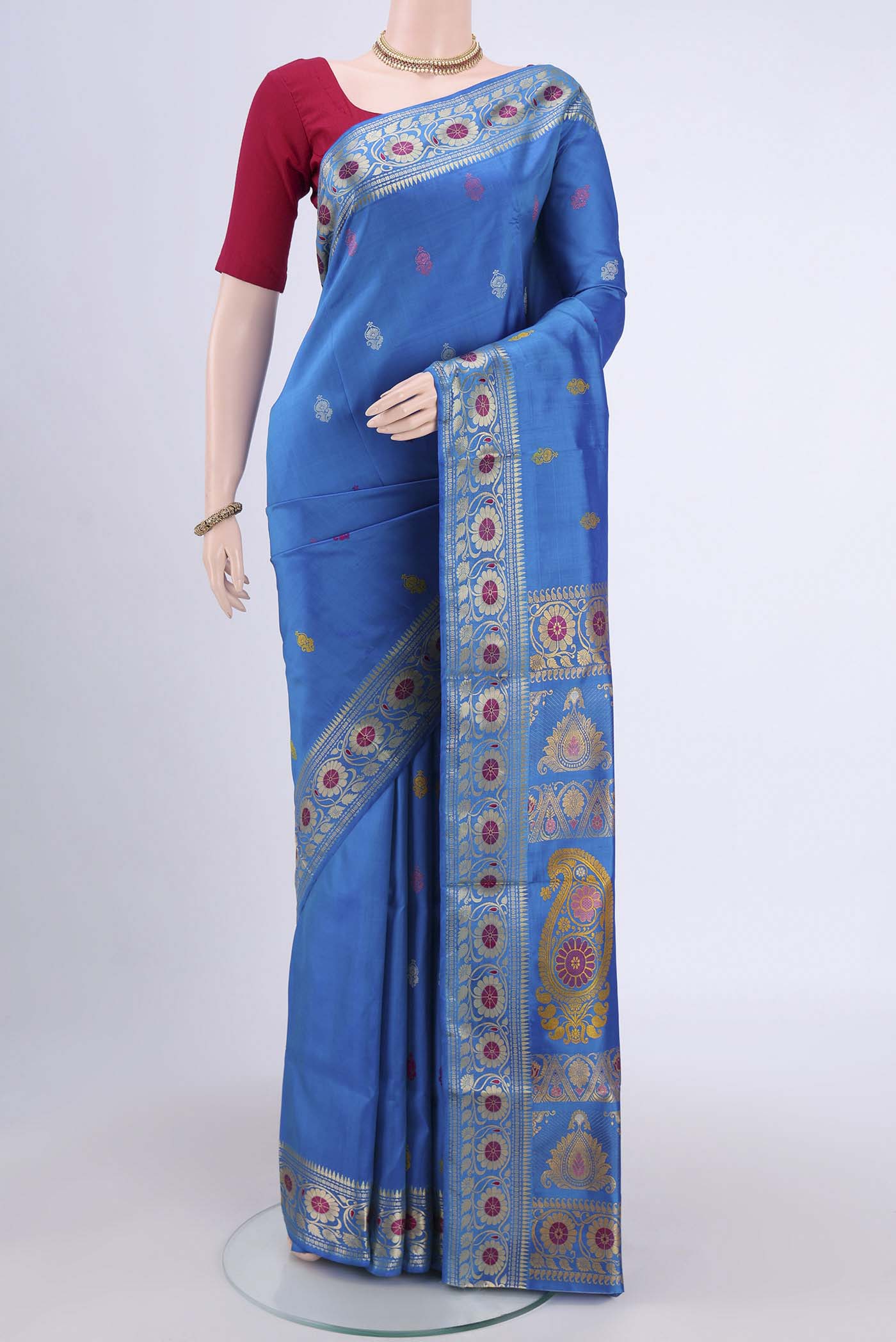 Blue Dual Tone Baluchari Silk Saree with Thread Butta on the body and Thread Border.  displayed on a mannequin