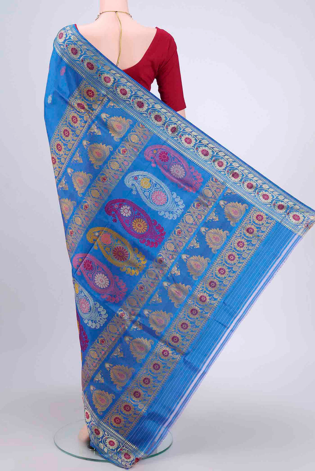 Flat view of Blue Dual Tone Baluchari Silk Saree with Thread Butta on the body and Thread Border. 