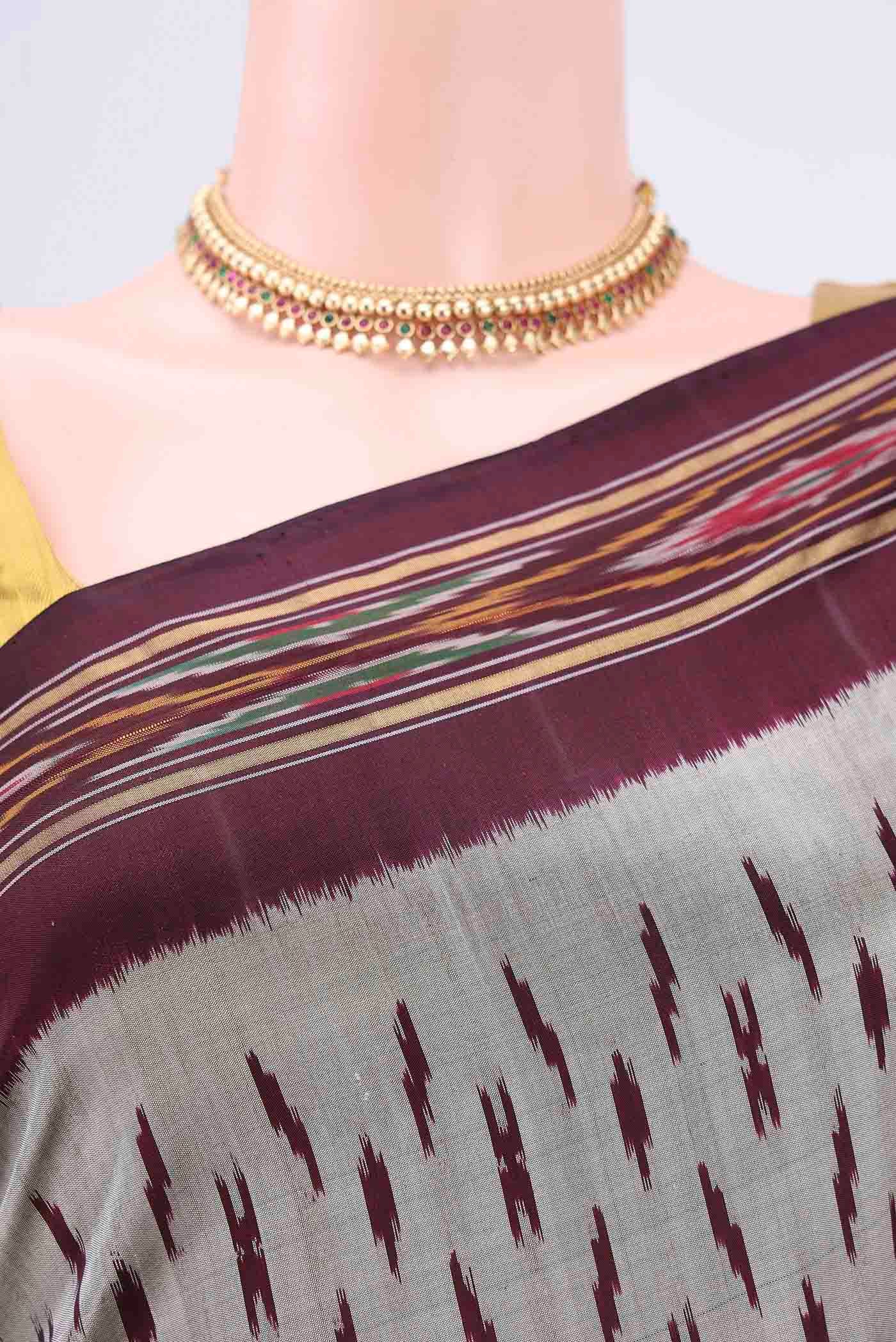 Border image of Silver Pochampally Silk Saree with Ikat design on the body and Zari Border. 