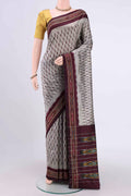 Silver Pochampally Silk Saree with Ikat design on the body and Zari Border.  displayed on a mannequin