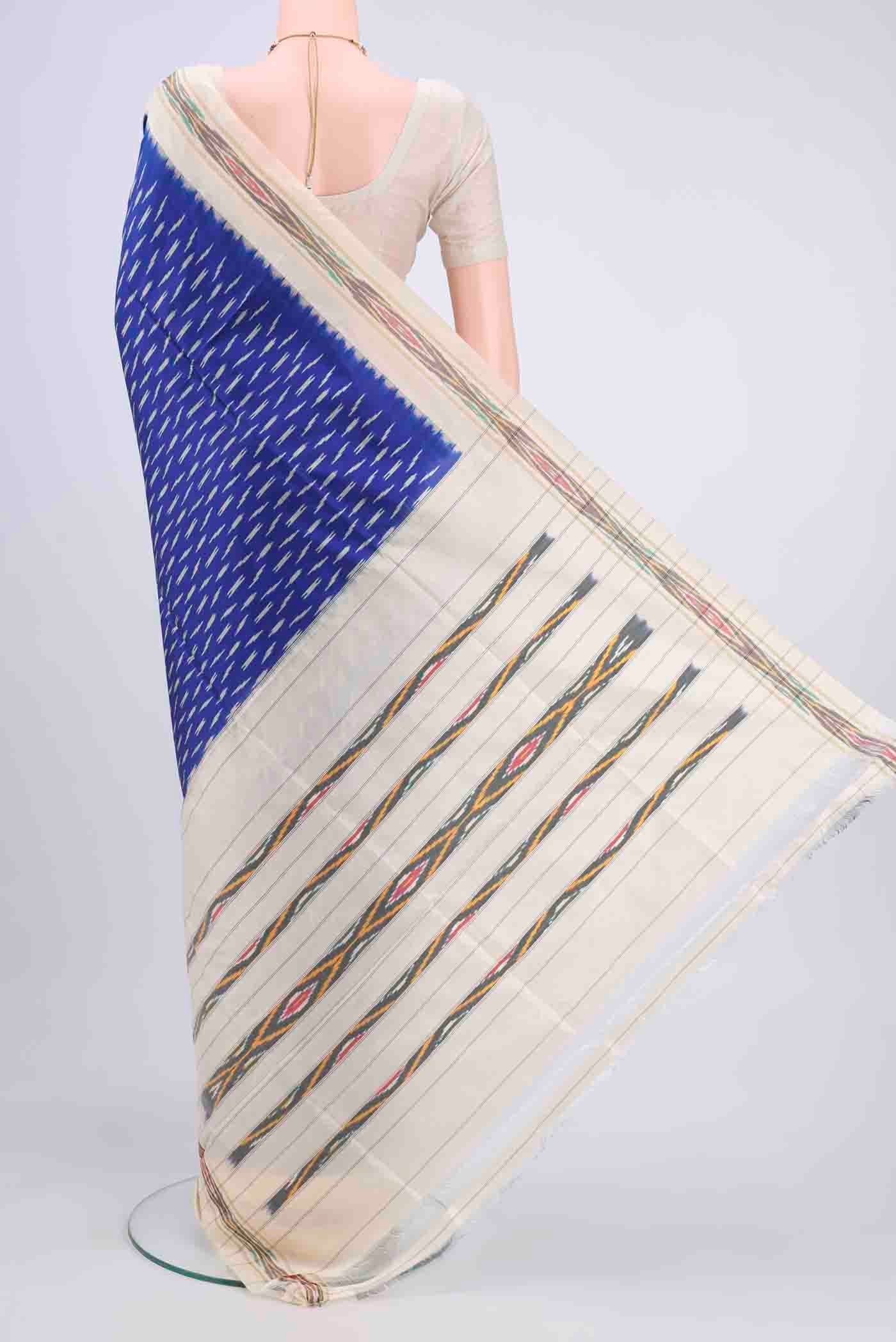 Flat view of Dark Blue Pochampally Saree with Ikat design on the body and Ikat Border