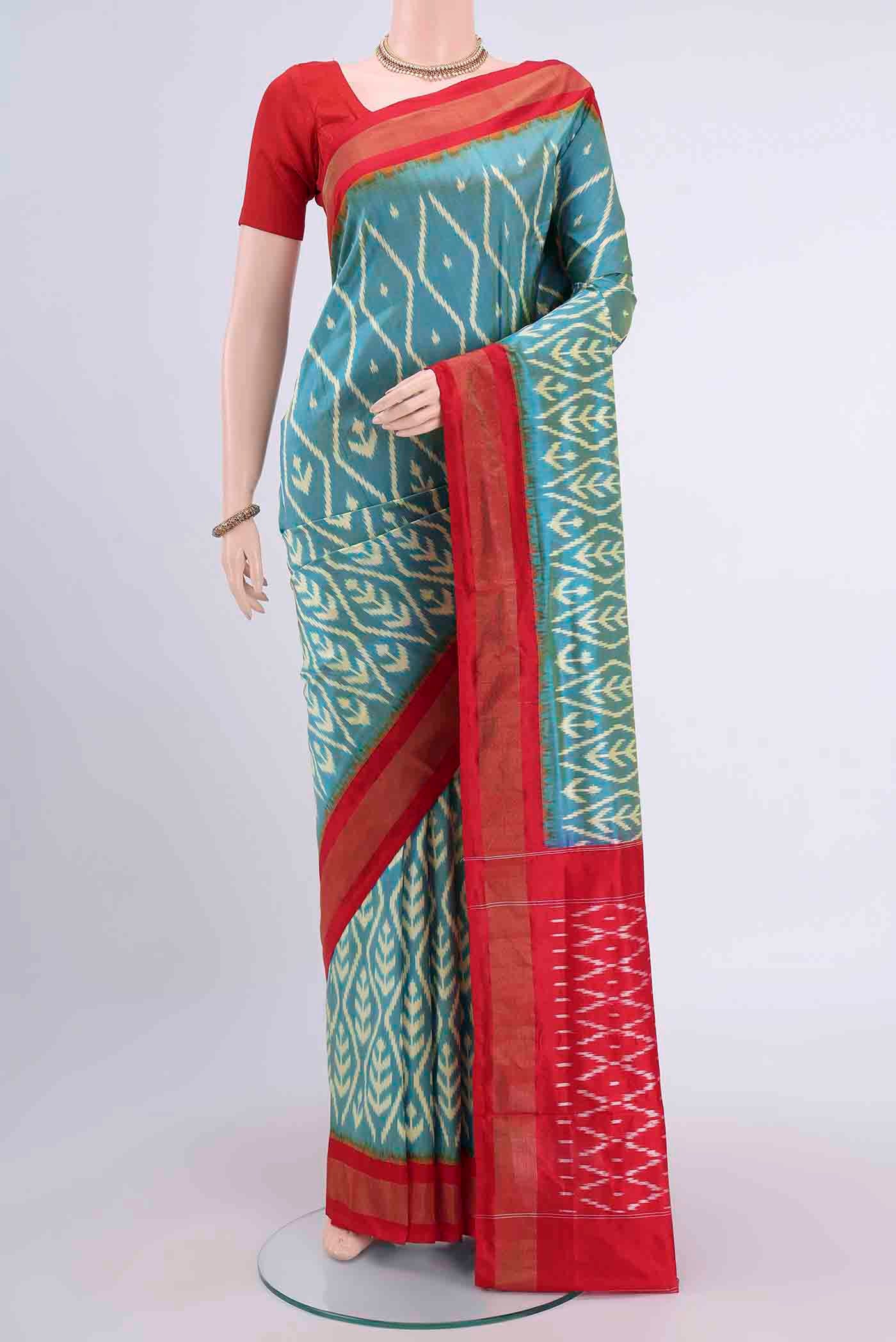 Light Blue Pochampally Silk Saree with Pure Ikat on the body and Zari Border displayed on a mannequin