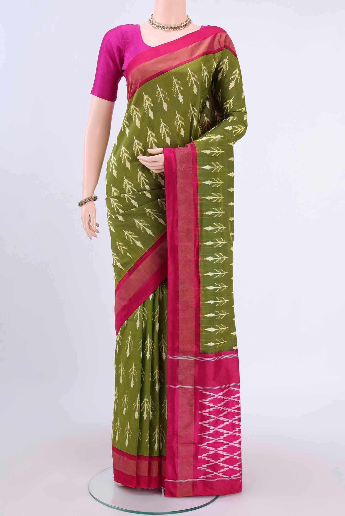 Mehandi Green Dual Tone Pochampally Silk Saree with Ikat design on the body and Ikat Border displayed on a mannequin
